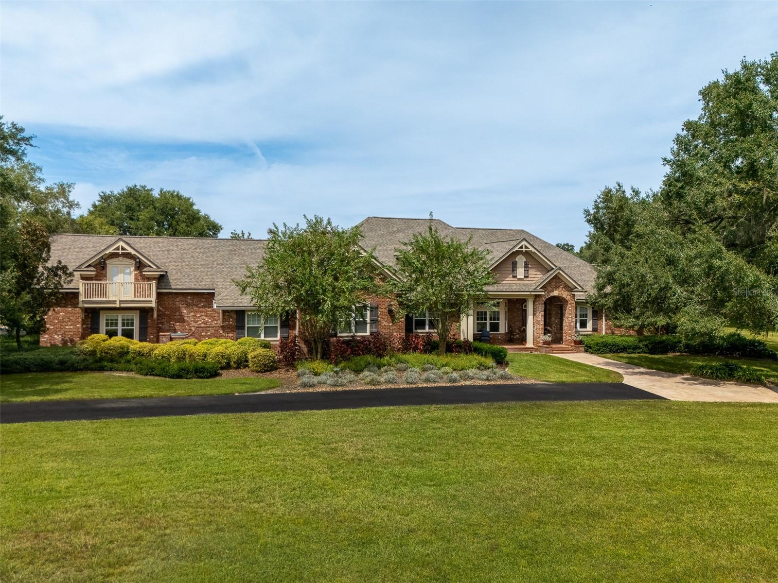 YOU HAVE ARRVED!
Welcome to this exquisite home in a prime location inside the gated subdivision of Steeple Chase Farms. As you enter the spacious circular
driveway, you are greeted by the grandest Live Oak Trees and picturesque landscaping. Nestled and perfectly situated on five (5) acres this
custom home consists of 5,200 sq. ft. +/-. Inside you'll find a gourmet kitchen with gas cooktop and exquisite cabinets! four bedrooms with four- and one-half bathrooms. Separate office and an additional
upstairs Media / Entertainment area. This home features an idyllic pool, spa and patio area that is sure to help you relax and unwind. The physical
location of this home and the amenities nearby are numerous. Jonesville Park where a wide range of athletic events take place, including soccer,
tennis, pickle ball along with biking and running paths. Shopping, restaurants and all of life's conveniences are less than three miles away. 
Steeple Chase Subdivision is an equine friendly community allowing he horse enthusiasts to enjoy the many miles of riding trails that surround the
area. There is a 2-stall barn and an additional 600 square foot climate controlled multi use space. This location is truly second to none.
DONT MISS THIS OPPROTUNITY.