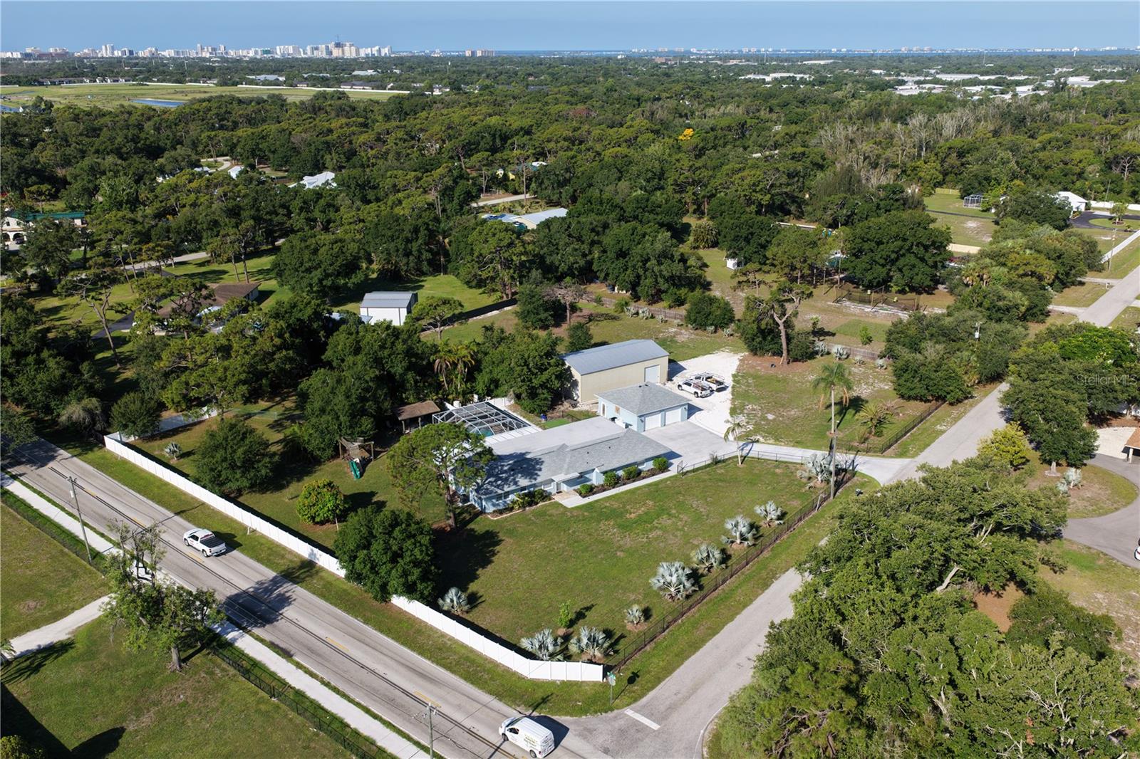 Check out this Fully fenced 2.25 Acre Compound in Desoto Acres. This property boasts a  Electronic gate that leads you to the oversized 2 car detached 30x30 garage. The massive driveway and walkway to home was completed redone with 50 yards of concrete.  The home boasts many recent improvements including a NEW Roof in 2023, Hot Water heater in 2022, both AC Units replaced in 2022.  The Oversized Pool/Hot tub/Cage had a complete makeover in 2022 with Solar or Gas heat and right outside the pool cage is a 16x12 Barbeque Canopy with installed gas line for the grill.   A HUGE Warehouse  awaits situated behind the 2 car garage. It was built in 2022 and is 35x50, 1750 Sq ft with storage Mezzanine, foam insulation and huge fans.  Great for your boats, RVs, and all the toys. RE1 zoning with NO HOA/Deed Restrictions.  This will go fast.
