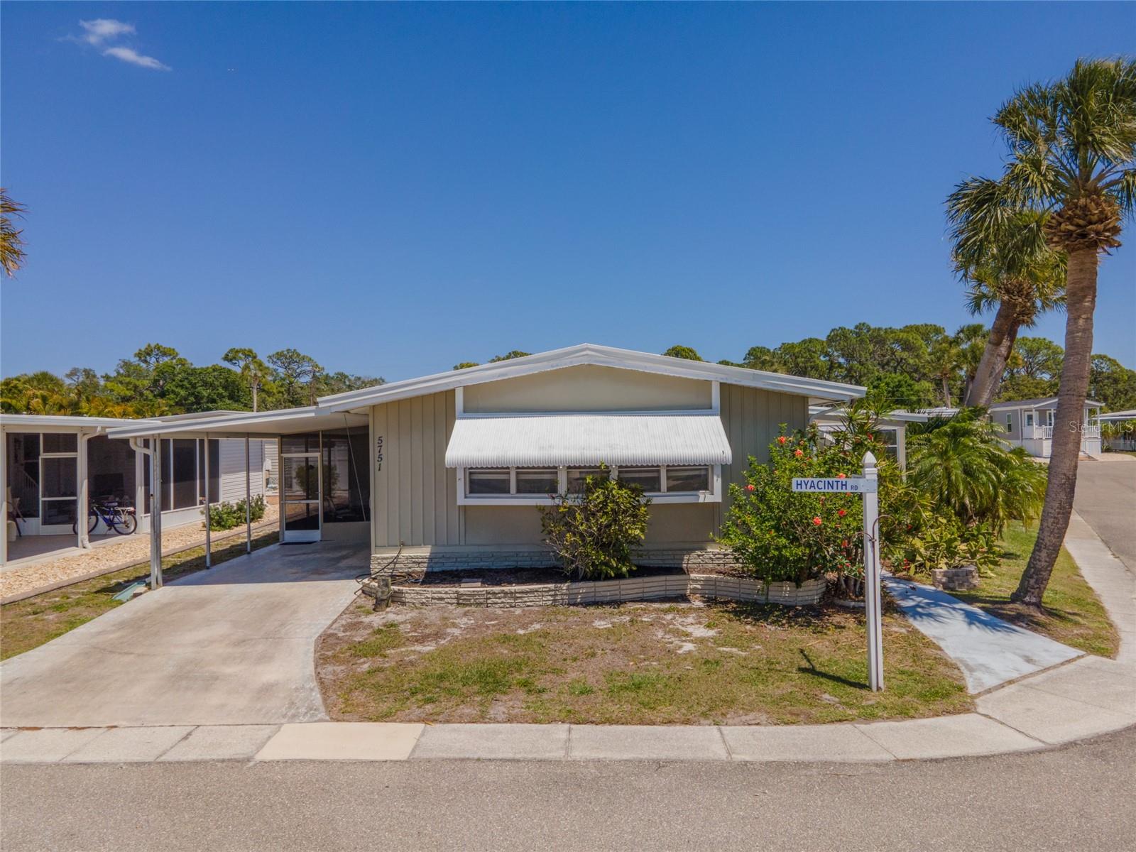 Bring your swimsuits and flip flops and come on down to this TURNKEY FURNISHED manufactured home in the highly sought-after 55+ community of Japanese Gardens of Venice. This home offers peace of mind with a ROOF REPLACED within the last 5 years and a humidistat for year-round comfort. With water, sewer and cable covered in your HOA dues, this retreat is designed for easy Florida living, blending functionality with charm in a low-maintenance setting.***

Step inside to a light-filled living and dining area, highlighted by a LARGE BAY WINDOW that brings in natural light and creates a warm, welcoming atmosphere. The layout flows effortlessly into the rest of the home, leading to an ENCLOSED FLORIDA ROOM, the perfect spot to relax with your morning coffee or unwind in the evening breeze. The SPACIOUS PRIMARY BEDROOM features a LARGE WALK-IN CLOSET, while the en-suite bathroom offers a TUB WITH A BUILT-IN SHOWER BENCH, LINEN CLOSET, and a dedicated MAKEUP VANITY. Guests are comfortably accommodated with their own bathroom located just across the hall, providing privacy and convenience. Even more gathering space awaits in the SCREENED LANAI where you can play a game of cards or enjoy the tranquil neighborhood. Beyond, a utility room makes laundry a breeze.~~~

Life in Japanese Gardens of Venice is all about enjoying a vibrant, active lifestyle. Residents love taking advantage of the COMMUNITY POOL, CLUBHOUSE, FITNESS CENTER, AND ORGANIZED SOCIAL EVENTS that make it easy to stay connected and engaged. Whether it’s joining group activities, meeting neighbors for gatherings, or utilizing the various sport courts, this community offers a relaxed yet lively Florida lifestyle just minutes from beaches, dining, and everything Venice has to offer. Call today to schedule your showing and claim this lifestyle!