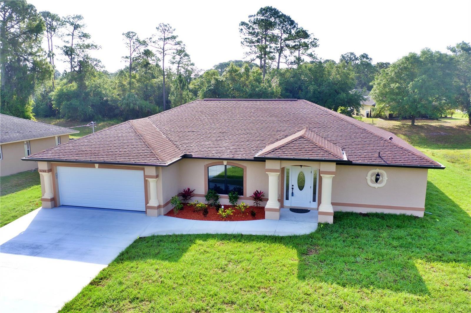 Under Construction. Photos shown are from another home recently completed by the same builder and are for reference purposes only. If you are looking for the same floor plan that is already completed and move-in ready, the same builder has one available at 4851 Kennett St, North Port, FL 34288. ***BRAND NEW POOL HOME ON FRESHWATER CANAL*** This yard comes equipped with a multiple zone sprinkler system.. Featuring TWO Master Suites! As you walk through the front door you are greeted with a large open living area and vaulted ceilings. Light pours in through the pocket sliding door that leads out to the private pool and freshly landscaped yard overlooking a Freshwater Canal. Enjoy an elevated kitchen design featuring granite countertops, wood cabinets with soft close drawers, stainless steel appliances, and pantry closet and impact windows and sliders. With plenty of room to spread out in this split-floor plan, your family and visitors will enjoy the tile that flows throughout the living area and all wet areas of the home as well as the warmth of carpeted bedrooms. Each master suite offers a generous footprint and plenty of storage space with his & hers walk-in closets. The spaciousness continues into each master bathroom which offers double sinks, oversized walk-in tiled showers, ample lighting and linen closets. Granite countertops and wood cabinets with soft close drawers are provided in each of the three full bathrooms. The third bathroom acts as a pool bath and the third bedroom offers even more space to help you call this house your home! Enjoy peace of mind with a 2-10 New Construction Home Warranty included in the sale of this brand new home. This home won't last long... Schedule your showing today! The pictures from the previous build may have different design, fixtures and color and flooring choices. Taxes reflect the land only. A few of the pool pictures are renderings from the pool company.