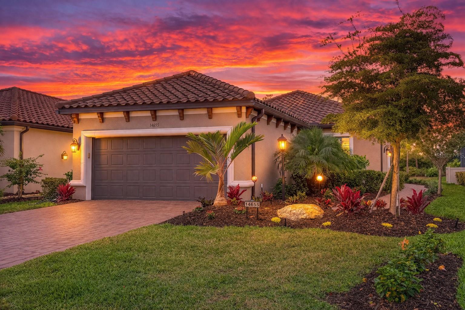 One or more photo(s) has been virtually staged. GOLF Deeded Lot **Sellers will pay HOA fees through 12/31/26 with an accepted contract** for this thoughtfully designed Roma floor plan residence offering refined upgrades, privacy, and effortless indoor-outdoor living. This two-bedroom home with a dedicated study, two baths, and an EXTENDED two-car GARAGE is set on a desirable WESTERN-EXPOSURE privacy lot, capturing beautiful Florida sunsets. A private side entry opens to a bright, open layout where the designer kitchen anchors the home. The kitchen features upgraded Café appliances, an EXPANDED flat ISLAND for additional prep and gathering space, soft-close cabinetry, an Italian MARBLE backsplash, and a motion-sense kitchen faucet. It flows seamlessly into the great room and out through sliding glass doors to a COVERED and EXTENDED SCREENED LANAI, equipped with a natural gas line for grilling, creating an inviting indoor-outdoor living experience. The primary bedroom is positioned off the great room and includes a DOUBLE WALK-IN CLOSETS with CUSTOM, SOLID STORAGE by Closets by Design. The primary bathroom is a spacious retreat with a walk-in shower and dual sinks. The second bathroom features DUAL ACCESS from both the secondary bedroom and the main hall, providing flexibility and convenience. A dedicated study offers the ideal space for a home office or quiet retreat. This home is enhanced by a long list of upgrades, including HURRICANE-IMPACT WINDOWS with a transferable lifetime warranty, custom window treatments with 2" faux wood blinds and powered sun shades, ANTI-MOLD grout treatment in both bathrooms, remote-controlled ceiling fans throughout, a custom dining room light fixture, and new professionally designed landscaping by Bella Scapes. The garage is four feet deeper than standard and includes CUSTOM STORAGE, while a five-filter REVERSE OSMOSIS water system and SOFTENERS adds everyday comfort and quality. Located within Esplanade at Azario, a 600-acre bundled golf community by Taylor Morrison, residents enjoy deeded golf with no equity buy-in, an 18-hole championship course, and an exceptional collection of resort-style amenities. From dining, fitness, and wellness to social events guided by an on-site Lifestyle Director, Esplanade delivers a true year-round vacation lifestyle. Set in the heart of Lakewood Ranch, one of Florida’s most sought-after master-planned communities, this location offers quick access to I-75, Tampa and Sarasota, world-class beaches, University Town Center shopping, major employment hubs, cultural attractions, professional sports, and multiple airports. Convenience, connection, and quality of life come together here.