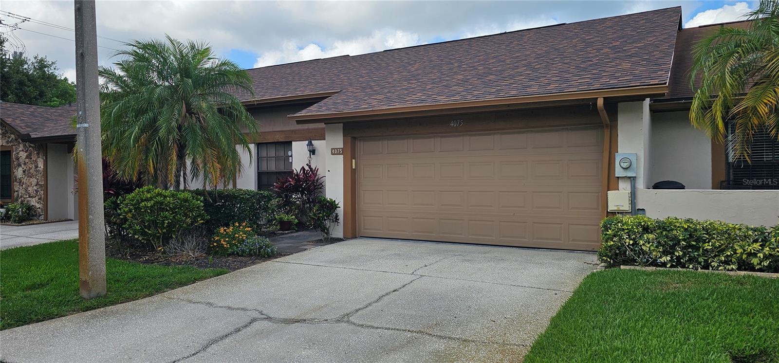 Seller says sell!  Come and see this gem located in The Cluster at Carrollwood Springs become available.  This 2 BR/2BA-- with a 2 car garage!! --backs up to a beautiful community lake.  This popular unit features a beautifully redone kitchen with granite counter tops, stainless steel appliances that looks into the DR/LR area.  Vaulted ceilings and solar tubes provide bright open living areas!
Washer/Dryer included.  HVAC replaced in 2023.  The 9x22 rear porch has vinyl/screened windows which allow you to utilize this incredible space all year round.  There is also a 09x12 bonus room off the rear of the primary bedroom that can be used as an office or private sitting room.  
The Clusters at Carrollwood Springs is a gated (non Guard) community that also features a heated community pool, clubhouse and very low community fees.  
This is a private, secure and well kept community.
