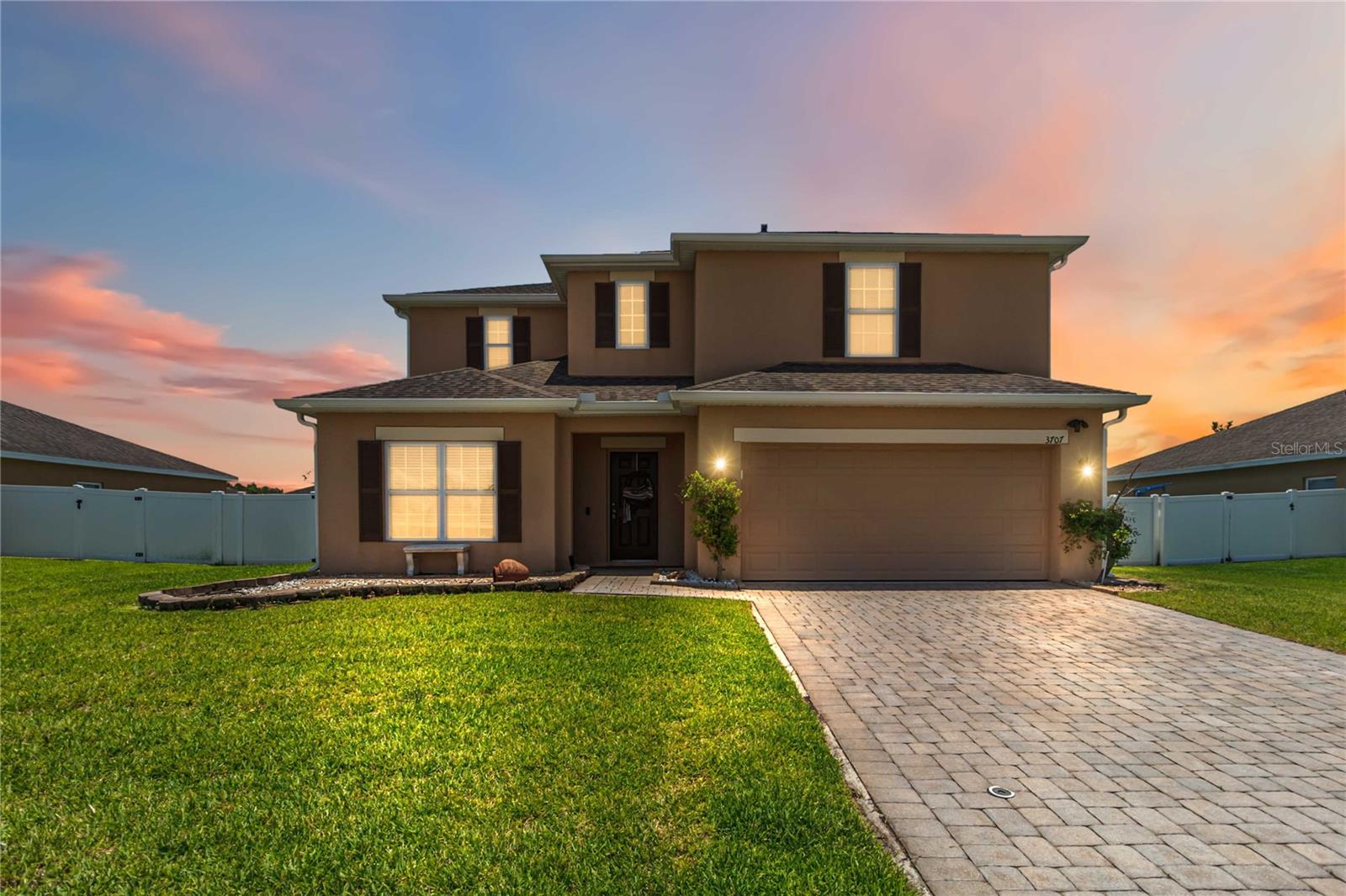Welcome to Deer Creek! This beautifully maintained 5-bedroom, 3.5-bathroom two-story home offers the perfect blend of space, style, and energy efficiency. Situated on just under a quarter-acre lot, this impressive residence features a paid-off whole-house solar system and a water purification system, providing both energy savings and enhanced water quality throughout the home.

As you enter, you'll be greeted by soaring ceilings in the grand foyer, creating an inviting and open atmosphere. The thoughtfully designed floor plan features a spacious living room, dining area, and kitchen combination that's perfect for both everyday living and entertaining. The chef-inspired kitchen boasts granite countertops, stainless steel appliances, a large center island with ample bar seating, and abundant counter and cabinet space.

The first floor includes a convenient guest bedroom and 1.5 bathrooms, making it ideal for visitors or multigenerational living. Tile flooring flows throughout the main living areas, while cozy carpeting adds comfort to the upstairs bedrooms and loft.

Upstairs, you'll find a spacious loft, four generously sized bedrooms, and a laundry room complete with a washer and dryer that convey with the home. The expansive primary suite offers a relaxing retreat with dual vanities, a garden tub, separate walk-in shower, and an oversized walk-in closet. Three additional bedrooms and a full bathroom provide plenty of room for family and guests.

Step outside to enjoy the large, fully fenced backyard featuring a spacious paved outdoor area, perfect for outdoor dining, entertaining, or relaxing. Additional highlights include a 2-car garage, paved driveway, roof (2016), A/C (2025), appliances (2022), and the added peace of mind of a whole-house water purification system.

Located in the desirable Deer Creek community, residents enjoy a playground, low HOA fees, and NO CDD. Conveniently situated just minutes from shopping, medical facilities, a K-8 school, and Florida's Turnpike, this move-in-ready home truly has it all. Schedule your private showing today!
