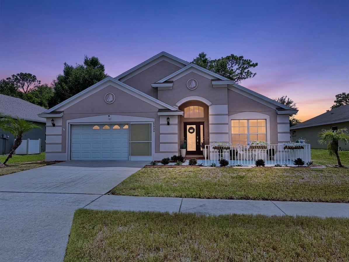 Welcome to this beautifully maintained 4-bedroom, 2-bath home located in a desirable gated community in Hudson! Designed with comfort and functionality in mind, this spacious residence features an open layout with soaring cathedral ceilings, neutral finishes, ceramic tile, and high-end laminate flooring throughout the main living areas.

The updated kitchen showcases refreshed cabinetry with modern hardware, stainless steel appliances, generous storage, and easy access to the dining area, making it perfect for both everyday living and entertaining. The spacious living room opens through sliding glass doors to a large enclosed patio, creating the ideal space to relax or host guests year-round.

The primary suite offers a private retreat complete with a walk-in closet, dual vanities, a relaxing garden tub, separate walk-in shower, and private water closet. A guest bedroom also features a walk-in closet, while an additional bedroom provides the flexibility to serve as a nursery, playroom, home office, or hobby room.

Outside, you'll appreciate the wrought iron fenced backyard, two-car garage, Nest smart thermostat, and Vivint security system. The backyard storage sheds do not convey.

Living here means enjoying a low-maintenance lifestyle with HOA dues that include cable TV, high-speed internet, trash service, access to the community clubhouse and swimming pool, plus the security and convenience of a gated entrance.

Conveniently located near shopping, restaurants, schools, golf, and the Gulf Coast, this move-in-ready home offers the perfect combination of comfort, convenience, and value.