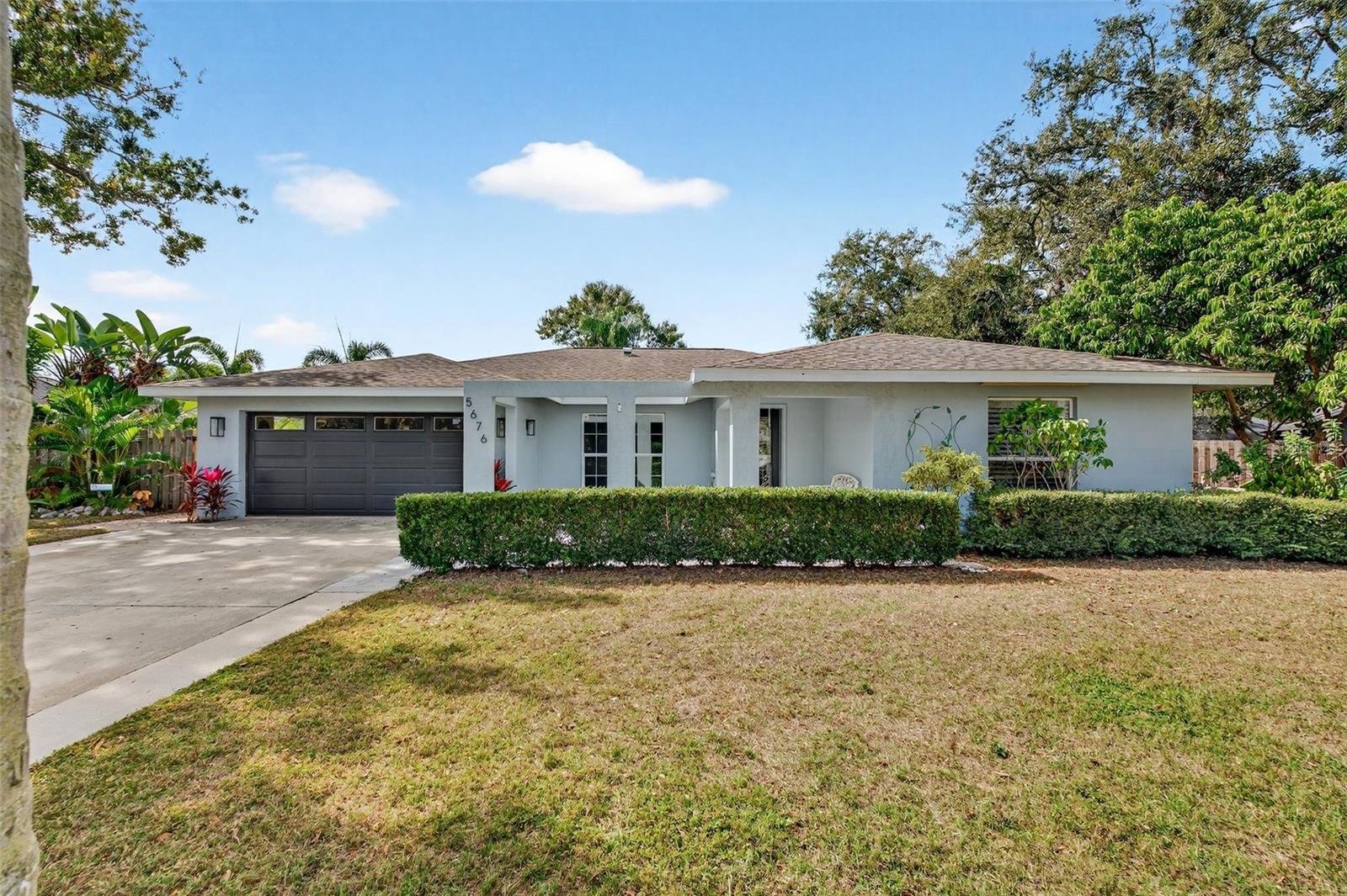 Welcome to your own private slice of paradise in the highly sought-after Beneva Woods community! This beautifully renovated home offers an unparalleled blend of luxury living and serenity, maturely landscaped privacy, perfect for both entertaining and relaxation. Prepare to be wowed by the stunning custom luxury heated saltwater pool, the centerpiece of your backyard retreat. Featuring marble decking, a glass tile infinity spa, and a convenient pool bar with refrigerator! This area is designed for the ultimate Florida lifestyle, seamlessly extending your living space outdoors across beautiful brick paver patios. The interior is impressive, offering high-end finishes and modern comforts throughout. Upgrades include renovated bathroom, newer appliances, new paint inside and out, 6 year old roof, and upgraded light fixtures! Located in a tranquil neighborhood known for its canopy-covered streets, you are just minutes away from top-rated schools, shopping centers, restaurants, and a short drive to the world-renowned Siesta Key beaches. Don't miss this rare opportunity to own a meticulously maintained and thoughtfully upgraded home in one of Sarasota's most coveted neighborhoods. Schedule your private showing today—this remarkable property won't stay on the market long!