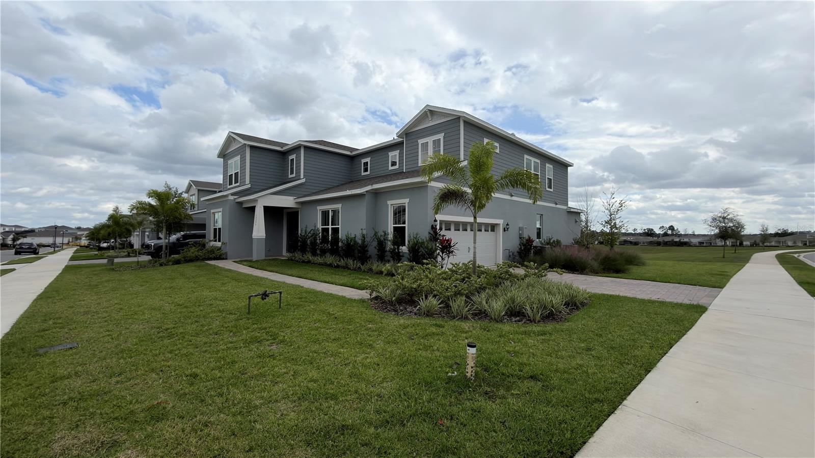 Stunning Roseland Model Home in Willow Ridge – Over $250K in Upgrades!

This never-lived-in Roseland model home in the sought-after Willow Ridge community of Montverde offers the perfect blend of luxury, comfort, and location. Featuring over $250,000 in upgrades (see attachment for full list), this home is only minutes from Mt. Dora, Downtown Winter Garden, Clermont and Minneola—close to endless shopping, dining, entertainment, the South Lake Hospital and a brand new Advent Health Hospital. This home is zoned for highly rated schools, only a few minutes from the prestigious Montverde Academy and less than a mile from the Turnpike. This gated, natural gas community features a private pool with cabana, fire pit area, 1 Gig of internet with streaming TV, and no CDD fees!

Set on an oversized corner homesite backing to lush green space, this 5-bedroom, 5-bathroom masterpiece offers privacy and style. Enjoy peace of mind with a whole-home water purification and alkalization system. Step through the double entry doors into a dramatic foyer that rises to the second floor, immediately setting the tone for this extraordinary home. To one side, a custom-enclosed flex room with built-in library and office furniture provides a perfect work-from-home retreat. The formal dining room flows seamlessly into the heart of the home—the chef-inspired gourmet kitchen.

Equipped with Kitchenaid stainless steel appliances, including a built-in natural gas cooktop and top-of-the-line Samsung smart refrigerator, this kitchen is both functional and stunning. Elegant Winstead White soft-close stacked cabinetry pairs beautifully with quartz countertops, while a spacious walk-in pantry with custom built-ins ensures exceptional storage. The open-concept layout connects the kitchen to the gathering room and café, featuring a modern, high-end TV wall that creates a welcoming space for entertaining.

Step outside through the pocket sliding glass doors to a covered lanai designed for year-round enjoyment. Complete with a built-in outdoor kitchen, pre-wiring for a pool or spa, and a dedicated pool bath, this backyard is an entertainer’s paradise.

Also on the first floor, the Multi-Generational Suite offers a private en suite bathroom with a glass-enclosed shower, linen closet, and walk-in closet—ideal for guests or extended family.

Upstairs, a spacious loft with a custom modern TV wall provides a relaxing retreat, with the option to mount a TV or ceiling projector. The owner’s suite spans one side of the home, offering a private sitting area and a spa-inspired bathroom with a garden tub, frameless glass shower, enclosed toilet, and dual walk-in closets. Three additional bedrooms complete the second floor—two share a Jack and Jill bath, while the third features its own en suite. The upstairs laundry room with a utility sink and custom cabinetry adds convenience and style.

With over $250K in thoughtful upgrades, this home combines luxury, functionality, and a prime Montverde location.

Don’t miss the opportunity to make this exceptional home yours—schedule your private tour today!