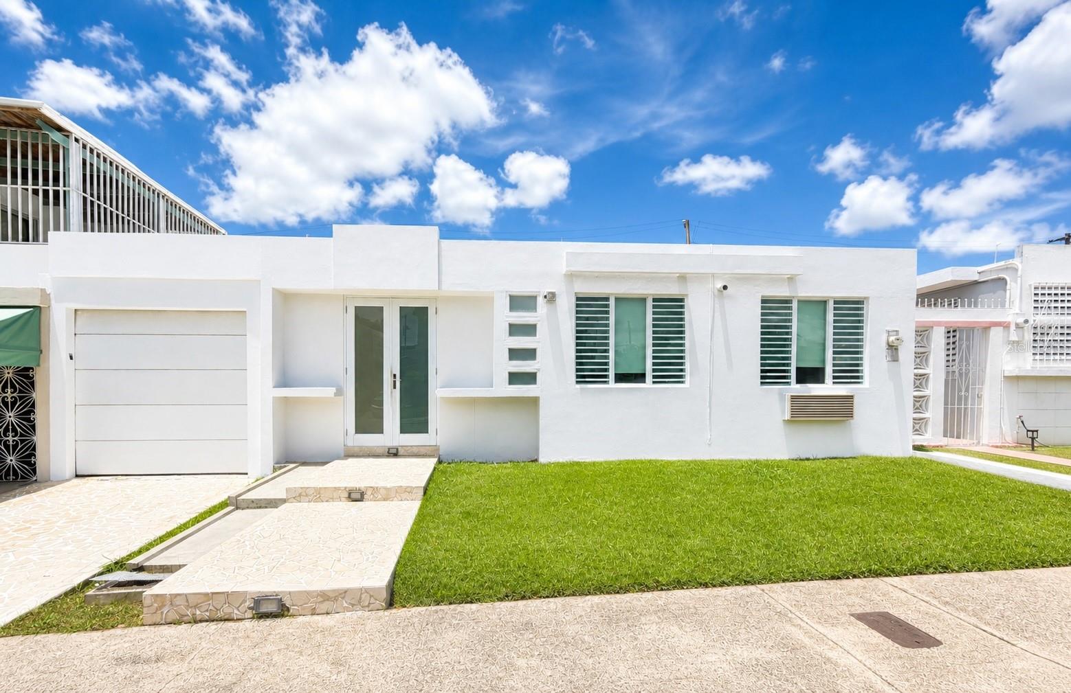 Excellent opportunity to own a property with a separate guest unit, ideal for multi-generational living or additional income potential in Summit Hills, San Juan.

The main residence features 3 bedrooms, 2 bathrooms, a functional kitchen, and an open-concept layout connecting the living and dining areas, offering a comfortable and efficient design with great natural light. Includes a back-to-back carport for 2 vehicles and a patio area with a combination of concrete and green space, perfect for outdoor enjoyment.

Additionally, the property offers a separate guest area with 1 bedroom, 1 bathroom, a living space, and kitchenette-ready setup, providing flexibility for guests, extended family, or rental opportunities.

Conveniently located near major highways, schools, shopping centers, and dining options. A great opportunity to own a versatile property in a prime location.

Property does not qualify for mortgage financing.