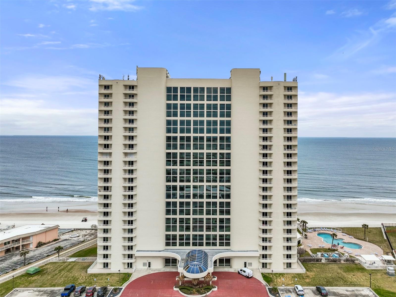 Seller financing available! 20 percent down, 3-year balloon loan at 6.75 percent.
OCEANFRONT TROPHY PROPERTY — THIS IS FAR MORE THAN A CONDO. IT’S A STATEMENT OF ARRIVAL. *FOUR BEDROOM* UNLIKE ANYTHING EVER LISTED* POSITIONED ALONG 60 FT OF UNOBSTRUCTED PRISTINE DIRECT OCEANFRONT VIEWS. 

 COASTAL COUTURE AT ITS FINEST — WHERE SLEEK CONTEMPORARY DESIGN MEETS UNAPOLOGETIC GLAMOUR AND OCEANFRONT DRAMA. *BEING SOLD *TURN-KEY WITH FINE FURNITURE AND ACCESSORIES CURATED AND TAILORED BY A DESIGNER. *

 THIS EXTRAORDINARY *DOUBLE-UNIT RESIDENCE COMMANDS ATTENTION WITH ITS *GRAND SCALE, *REFINED SOPHISTICATION, AND *BREATHTAKING VIEWS OF THE ATLANTIC. EVERY DETAIL HAS BEEN CURATED TO DELIVER IMPACT — FROM THE *EXPANSIVE LIVING ROOM AND *ELEGANT *SITTING AREA WITH FIREPLACE, TO THE *PRIVATE THEATER ROOM WITH *WET BAR DESIGNED FOR EFFORTLESS ENTERTAINING.

 ENCOMPASSING *FOUR LUXURIOUS BEDROOMS EACH WITH ENSUITE BATHROOM INCLUDING *TWO OCEANFRONT PRIMARY SUITES AND TWO GUEST ROOMS. (2 unassigned parking spaces and 2 guest parking spaces.) WHILE THE SEAMLESS FLOW OF THE FLOOR PLAN CREATES AN EXPERIENCE THAT FEELS MORE LIKE A *PRIVATE HOME THAN A CONDOMINIUM, THIS RESIDENCE IS STRATEGICALLY POSITIONED ON THE FIRST FLOOR — PLACING YOU AT *EYE LEVEL* WITH THE ATLANTIC, *WHERE THE SOUND OF THE *WAVES AND THE SALT *AIR BECOME PART OF YOUR EVERYDAY LIVING. EASY ACCESS TO WALK YOUR PET STEPS AWAY.  (2 pets 20 pounds each) 

 FROM THE MOMENT YOU ENTER, YOU’RE WELCOMED INTO A SLEEK, *OPEN-CONCEPT SHOWPIECE DESIGNED TO IMPRESS. THE EXPANSIVE *CHEF’S KITCHEN IS A STATEMENT IN ITSELF — *DRAMATIC DARK SEMI-CUSTOM CABINETRY, *RAISED CEILING WITH LED RECESSED LIGHTING, WHITE GLOSSED UPPER CABINETS, A *STRIKING THREE-DIMENSIONAL BACKSPLASH, AND LUXURIOUS QUARTZ COUNTERTOPS THAT INVITE GATHERING AND ENTERTAINING WITH EASE.

 APPOINTED WITH A *THERMADOR REFRIGERATOR, *BOSCH DOUBLE OVENS AND MICROWAVE, A *WOLF induction COOKTOP, AND A *WINE REFRIGERATOR, THIS KITCHEN DELIVERS BOTH PERFORMANCE AND POLISH. A FULL BUTLER’S PANTRY WITH *CUSTOM SHELVING, ADDITIONAL CABINETRY AND A WASHER AND DRYER IS *CLEVERLY* *HIDDEN BEHIND *SEAMLESS CABINETS — OFFERING FUNCTION WITHOUT INTERRUPTING THE CLEAN, SOPHISTICATED DESIGN.

 THE MAIN LIVING SPACE IS NOTHING SHORT OF BREATHTAKING. *30-FEET OF FLOOR-TO-CEILING GLASS FRAMES THE ENDLESS ATLANTIC, FLOODING THE RESIDENCE WITH NATURAL LIGHT AND BLURRING THE LINES BETWEEN INDOORS AND OUT. THE DOUBLE-UNIT LAYOUT PROVIDES AN EXPANSIVE FOOTPRINT RARELY FOUND ON THE OCEANFRONT — PERFECT FOR GRAND ENTERTAINING OR INTIMATE COASTAL EVENINGS. CONTEMPORARY LIGHTING FLOATS ABOVE CURATED FURNISHINGS, WHILE THE OPEN FOOR PLAN FLOW LEADS EFFORTLESSLY TO 60FT WIDTH OF OCEANFRONT TERRACE *OVERLOOKING LUSH GREEN SPACE*, ROLLING WAVES AND EXPANSIVE VIEWS BOTH UP AND DOWN THE COASTLINE-THE PERFECT SETTING TO ENJOY SUNRISES AND ROCKET LAUNCHES OVER THE ATLANTIC OCEAN.

 ONCE THE ORIGINAL KITCHEN, NOW TRANSFORMED TO A PRIVATE *THEATER ROOM. TRANSFORMS MOVIE NIGHT UNDER THE STAR LIT  LED CEILING INTO A RED-CARPET EXPERIENCE. RICH, *BLACK WALLS, DRAMATIC SCONCES, *RECLINING LEATHER SEATING, AND BOLD STATEMENT ART WALL CREATE AN CHIC SPACE. THE ZEBRA-PATTERNED RUG ADDS A FASHION-FORWARD EDGE — AND A *WET BAR WITH SINK, WINE REFRIGERATOR AND IRIDESCENT MIRRORED GLASS BACKSPLASH MAKES THIS THEATER THE ULTIMATE EXPERIENCE.
 All information deemed correct but should be verified. Measurements are approximate.