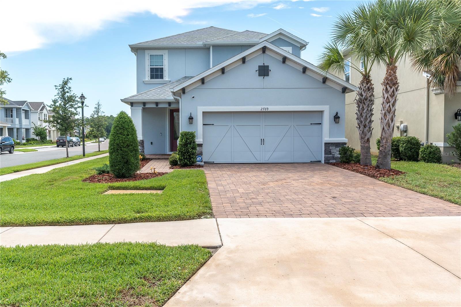 Virtually Staged. Starkey Ranch became a destination. This exceptional residence offers the opportunity to experience everything that has made it one of Tampa Bay's most celebrated master-planned communities.

Positioned on a premium corner homesite in the desirable Stansil Park section, this beautifully designed Taylor Morrison Anastasia offers 2,582 square feet of thoughtfully planned living space with 4 bedrooms, 3.5 bathrooms, a private office, spacious loft, and a highly sought-after first-floor primary suite.  Copy-paste for more info bit.ly/2769Dudley

From the moment you enter, soaring ceilings and expansive windows create an inviting sense of openness. The heart of the home is an impressive chef's kitchen featuring an oversized quartz entertaining peninsula, built-in oven, gas cooktop, designer backsplash, abundant cabinetry, a closet pantry, and generous prep space that flows seamlessly into the dining area and dramatic great room. Perfect for hosting family holidays, entertaining friends, or enjoying a quiet evening at home, the layout was designed to bring people together.

The first-floor owner's retreat offers privacy and comfort with a spacious bedroom, oversized walk-in closet, and a beautifully appointed ensuite bath featuring dual vanities and a large walk-in shower. A dedicated office provides the perfect work-from-home space, while the second level offers three additional bedrooms, two full bathrooms, and a generous loft that easily adapts as a media room, playroom, fitness space, or second family room. All new interior paint. Step outside to the covered lanai where Florida living truly begins. The partially fenced backyard provides plenty of room for pets, play, outdoor entertaining, or the future pool you've always envisioned. The corner homesite offers additional green space, and curb appeal that is difficult to duplicate.

The second level continues the home's thoughtful design with upgraded wood and iron stair and loft railings that add both architectural interest and an open, airy feel. A spacious loft creates the perfect gathering space for movie nights, a playroom, or an additional family room. Three generously sized bedrooms complete the upper level, including one with a private ensuite bath that offers ideal accommodations for guests or extended family, while the remaining two bedrooms share a beautifully appointed hall bath. 
Starkey Ranch has earned national recognition for blending modern amenities with Florida's natural beauty. Residents enjoy multiple resort-style pools, tennis courts, parks, playgrounds, dog parks, community gardens, year-round events, and more than 20 miles of scenic walking and biking trails that connect throughout the community and into the adjoining 18,000-acre Starkey Wilderness Preserve. Kayak launches, lakes, and expansive green spaces create a neighborhood where neighbors become friends and every day feels connected to the outdoors.

Highly rated Starkey Ranch K-8 School located within the community, while shopping, dining, medical facilities, and the Suncoast Parkway are minutes away. Tampa Airport, downtown, and the Gulf beaches are easily accessible, making this location as convenient as it is beautiful.

Built with modern construction standards, this home also offers the confidence of hurricane shutters, natural gas service, reclaimed irrigation, and a location in Flood Zone X for added peace of mind.