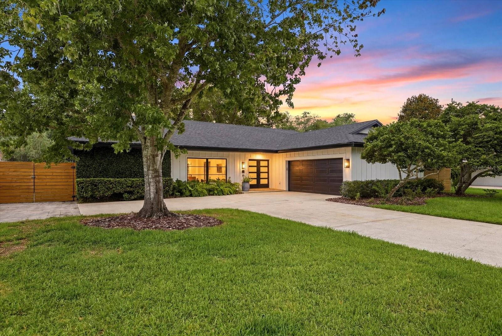Imagine biking to downtown Safety Harbor, launching your boat from Philippe Park, and returning home to a beautifully designed modern retreat. Offering designer finishes, wellness-focused features, and space for your boat or RV, this exceptional property combines luxury, functionality, and convenience just minutes from Tampa Bay.

This custom renovation by Kasper Modern Designs—a nationally recognized design-builder and recipient of the National Association of Home Builders Best in American Living Award—was completely reimagined in 2020. The firm has also been featured on two seasons of HGTV's 100 Day Dream Home. The result is a 3-bedroom, 2-bath residence showcasing premium materials, thoughtful craftsmanship, and modern design throughout.

At the heart of the home is a designer kitchen featuring custom cabinetry, a Dacor appliance package with a 36-inch induction cooktop, panel-ready refrigerator and dishwasher, large undermount sink, and ROHL faucet. Adjacent to the kitchen, a custom beverage bar includes a built-in wine cooler, beverage refrigerator, and nugget ice maker—ideal for entertaining.

The home's sleek aesthetic is highlighted by large-format porcelain tile flooring, architectural linear HVAC diffusers, high-end furnishings, and custom artwork by Christopher Matthews.

The split-bedroom floor plan provides privacy, while the spacious primary suite offers a custom walk-in closet, oversized walk-in shower with filtered water, and separate water closet. A dedicated laundry room with built-in workstation adds flexibility for remote work, study, or household organization.

Notable construction upgrades include a 2020 roof, PGT hurricane-impact windows and doors, 1.75-inch solid-core interior doors with Baldwin hardware, a 2025 insulated impact-rated garage door, Icynene spray foam insulation, and attic storage with pull-down ladder access.

Outside, professionally designed landscaping features mature olive trees, weeping podocarpus, landscape lighting, lush sod, and a spacious covered rear porch. The oversized driveway, two-car garage, and gated side parking pad provide ample room for a boat, RV, golf cart, or additional vehicles.

Previously operated as a successful wellness-focused short-term rental, the property includes whole-home water treatment, shower filtration systems, air purification, and other enhancements designed to support healthy indoor living. Short-term rental performance data is available upon request.

Located just one mile from Philippe Park and its public boat ramp on Tampa Bay, and only 1.5 miles from vibrant Downtown Safety Harbor, you'll enjoy easy access to restaurants, breweries, boutiques, coffee shops, festivals, and the waterfront lifestyle that makes Safety Harbor one of Tampa Bay's most desirable communities.

A rare opportunity to own a professionally designed home where exceptional craftsmanship, modern luxury, and everyday livability come together seamlessly.