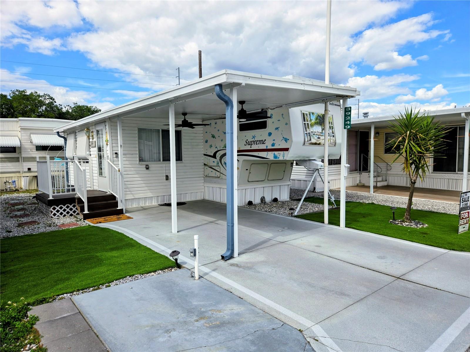 Motivated Seller!!!  Looking for the Active Florida Lifestyle. Welcome to Country Aire Village, a 55+ Co-op Community. Monthly Fees $140.00 includes internet, cable television, water, sewer, trash, amenities and more. This home is Tiny but Mighty and sporting all of it glorious 470 sqft. This R.V. home was built in 2001 and has been beautifully remodeled for a move-in ready experience. All you need is your suitcase and a toothbrush. The home is furnished with a queen bed, pull out sofa bed, Kitchen table and 4 chairs, new appliances and cabinets full of kitchen supplies, 2 televisions and more. The roof A/C is 2026 as well as the new hardwood floors. This home is yard maintenance free with beautiful artificial turf that will look its best all year round. Also a fantastic Bonus room with a stackable washer/dryer laundry closet. This extra room is a great space for crafting, home office, sitting room and what ever you need it to be. FREE parking for your R.V. or Boat in the 5 Acre lot. The Last two hurricanes were no match for this mighty little home as it sits high and dry on the North Side of the park. No power loss either due to the close proximity to the local hospitals. This park is centrally located an hour from the hottest Florida destinations like W.D.W., West Coast Beaches, Tampa International. Lots of Golf Courses near by as well as Restaurants and shopping. This Gem won't last long so call for your tour ASAP.
