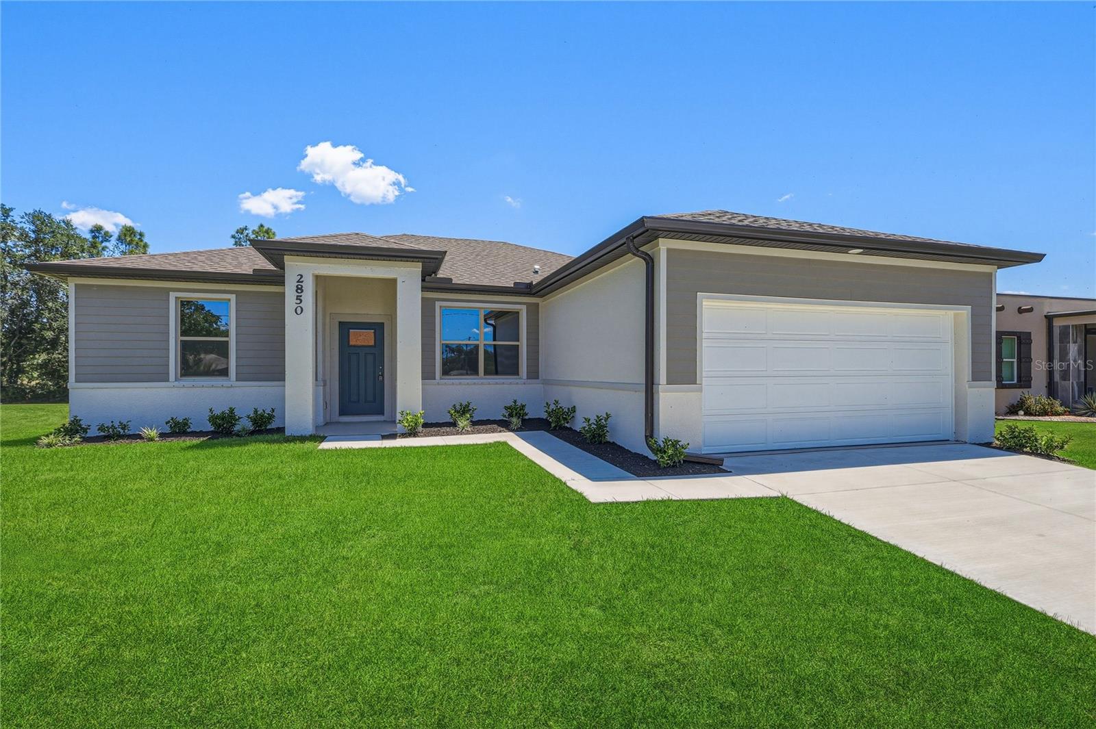 Here is the home you have been searching for and now offering 3% towards closing costs with preferred lender.  A new construction home with CITY WATER  in North Port and no HOA! This affordable new home is ready now! Closing Cost incentive and special financing for this home! The Acosta floor plan has a great layout with an open and versatile floor plan. Great location with easy access to shopping, schools, parks, medical and shopping just east of Toledo Blade Blvd. and South of E. Price Blvd. The home features 4 bedrooms, 2 full bathrooms, a formal dining room, a living room, an open kitchen, and a 2-car garage with 1,810 square feet of living space. The living space is well utilized, with ample room for large households. The high ceilings and interior features will give you the quality and luxury you were looking for in your new home. This home has a split layout with the primary suite on one end and the guest bedrooms on the other. The Primary bedroom has a tray ceiling and large windows that bring in natural light, plus a resort-style primary bathroom with a walk in shower, double vanity, and a large walk-in closet. The living room also receives plenty of natural light and has access to the covered lanai. The great room is open to the kitchen, where you’ll find a large center island for casual meals. The kitchen features stainless steel appliances, Shaker-style cabinets with crown molding, and granite countertops. The dining room is at the front of the home, with a nice size window providing even more natural light. The home includes luxury vinyl flooring throughout for durability and comfort. You’ll love these floors—easy to maintain and a trending design element in new homes. Other features include Shaker-style cabinets with hardware and granite countertops in the bathroom, tiled walls in the owner’s shower, and a tiled shower floor, a garage door opener, R38 insulation, 16 SEER AC unit and more. Take advantage of the seller’s warranty when purchasing this home. Check out any of our other homes under construction. We have a variety of locations and color schemes for you to choose from.