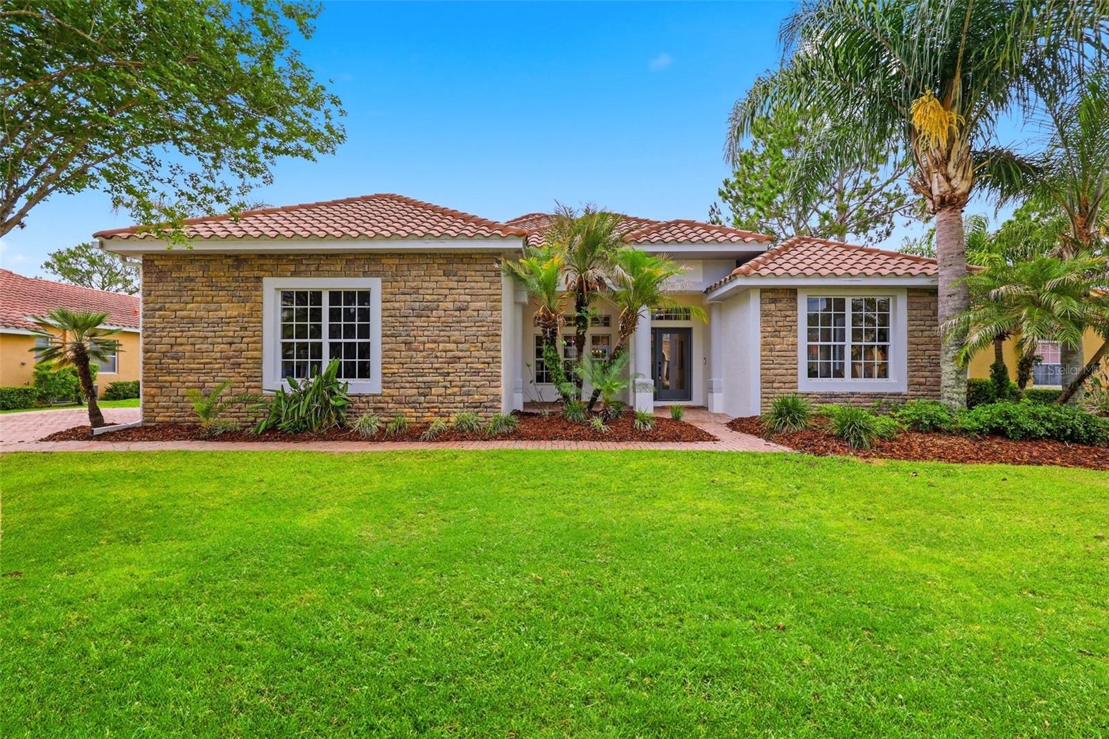 Welcome to Cory Lake Isles, where brick lined streets, towering palms, and a gated waterfront lifestyle create one of Tampa's most desirable communities. This beautifully updated 5 bedroom, 4 bathroom pool home offers a flexible floor plan designed to fit every stage of life.

The main level features the primary suite with two walk in closets and an ensuite bath with a soaking tub and separate shower, along with three additional bedrooms, including one ideal for a home office, nursery, guest room, or fitness space. The newly remodeled two tone kitchen blends style and function with abundant cabinetry, a large walk in pantry, and easy flow into the living areas.

Storage is abundant throughout, including an oversized walk in storage closet beneath the staircase, generous bedroom closets, and additional storage spaces rarely found in today's homes.

Upstairs, a private retreat offers endless possibilities with a spacious bonus room, large bedroom, full bath, walk in storage closet, and private balcony, making it ideal for multigenerational living, long term guests, a playroom, media room, or second living space.

Beautifully updated secondary bathrooms feature timeless subway tile surrounds, while the pool bath includes a full shower for added convenience. Beyond the cosmetic updates, buyers will appreciate the peace of mind that comes with recently updated AC units, hot water heater, pool heater, and pool equipment.

Step outside to your private pool and discover a home that offers the rare combination of space, flexibility, storage, and comfort in one of Tampa's premier gated communities.