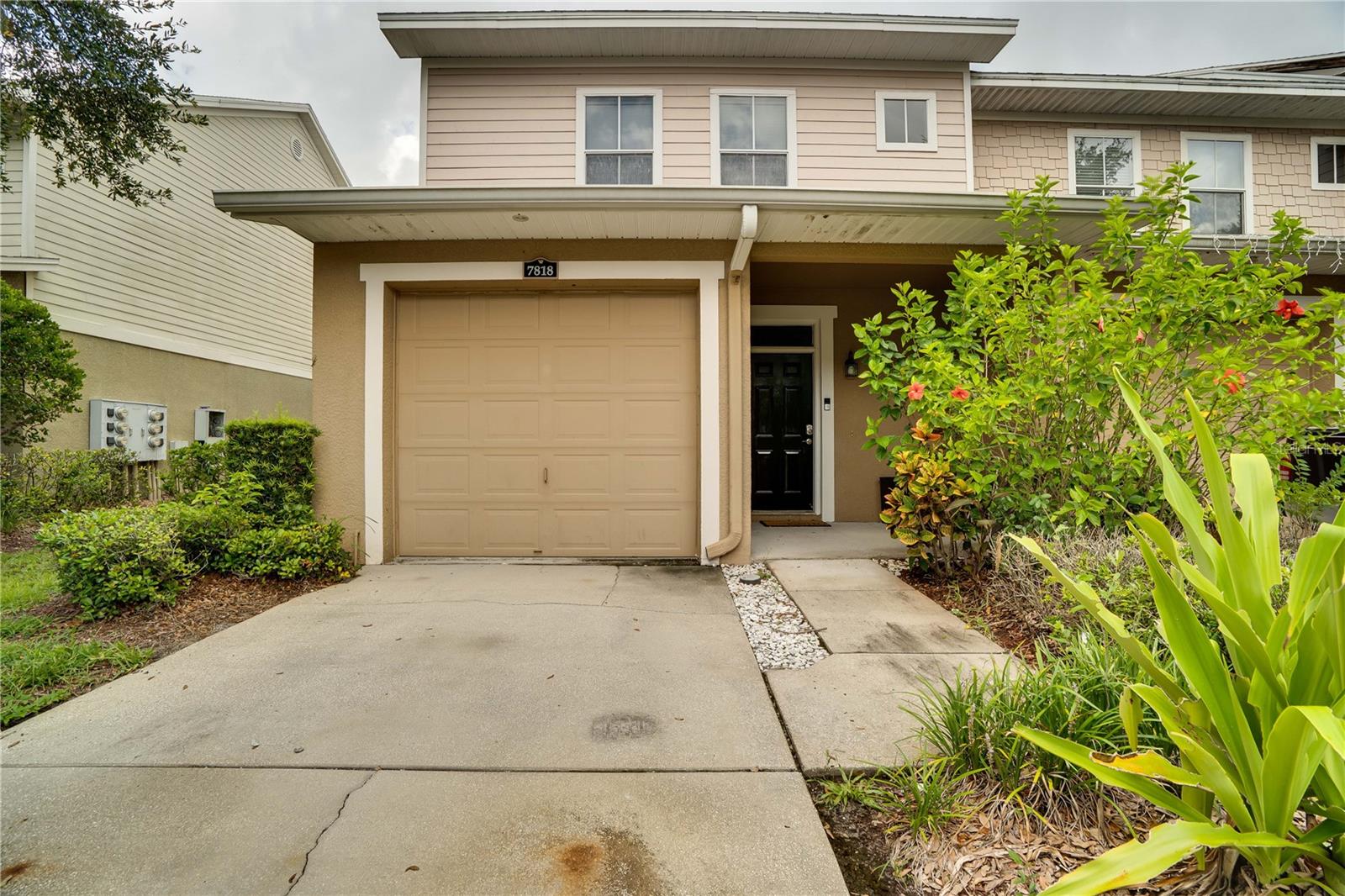 Some of the photos have been virtually staged or enhanced. Buyers are encouraged to see the beauty in person. Gated, Highly Desirable & Low-Maintenance Living! This spacious 3-bedroom, 2.5-bath townhome offers 1,822 sq. ft. of comfortable, modern living in a gated community designed for convenience and relaxation. Perfectly located for those on the go, you'll enjoy quick access to I-4 and I-75, and you're just minutes away from the Seminole Hard Rock Casino and Florida State Fairgrounds. Step inside to discover a welcoming open floor plan with a large kitchen, dining area, and living room that flows seamlessly to a private, screened-in patio —perfect for entertaining or relaxing. A convenient half-bath is thoughtfully positioned near the front entrance and attached garage. Upstairs, you'll find all three generously sized bedrooms, including the primary suite, as well as a full laundry room and two additional bathrooms. Community Features: pool Dog park Scenic conservation areas Guest parking Low HOA fees No CDD Don’t miss the opportunity to own a home in one of the area's most sought-after communities. Schedule your showing today!