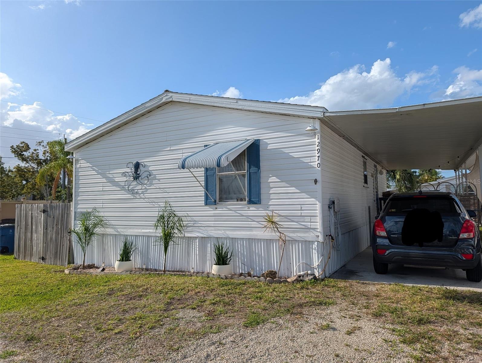 Welcome to this charming and well-maintained 3-bedroom, 2-bath home located in a great no HOA community with AIRBNB history just minutes from the area's beautiful beaches. Situated on land you own, this mobile home is classified as real property, offering an excellent opportunity for both homeowners and investors. The spacious open-concept floor plan creates a comfortable and inviting atmosphere, perfect for everyday living and entertaining. The home has been successfully operated as a full-time Airbnb, demonstrating strong income-producing potential for those seeking an investment property.  Enjoy a bright living area, functional kitchen, and comfortable bedrooms designed for easy living. While the home is being sold unfurnished, furnishings may be available through separate negotiation.  Whether you're looking for a primary residence, vacation getaway, or turnkey investment opportunity near the coast, this property offers exceptional value in a great location.