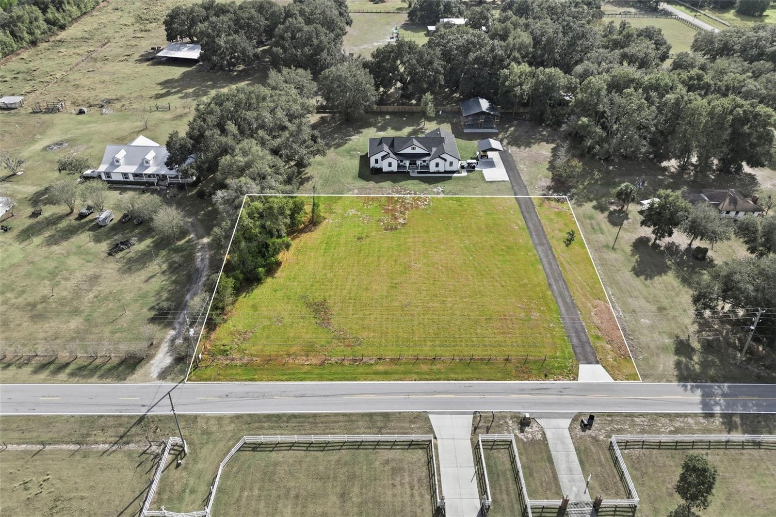 Build your dream home on this 1-acre high and dry residential lot located along desirable West Socrum Loop Road in North Lakeland. This parcel shares a driveway with 2914 W. Socrum Loop Rd and offers freedom to bring your own custom builder with NO HOA and no community restrictions. The property will require private well and septic system and electric service is available through Lakeland Electric. Enjoy a peaceful country feel while still being just minutes from shopping, dining, schools, and major roadways. Plenty of space for your home, outdoor living, and all your toys. A rare opportunity in a convenient North Lakeland location. Secure your new homesite today!