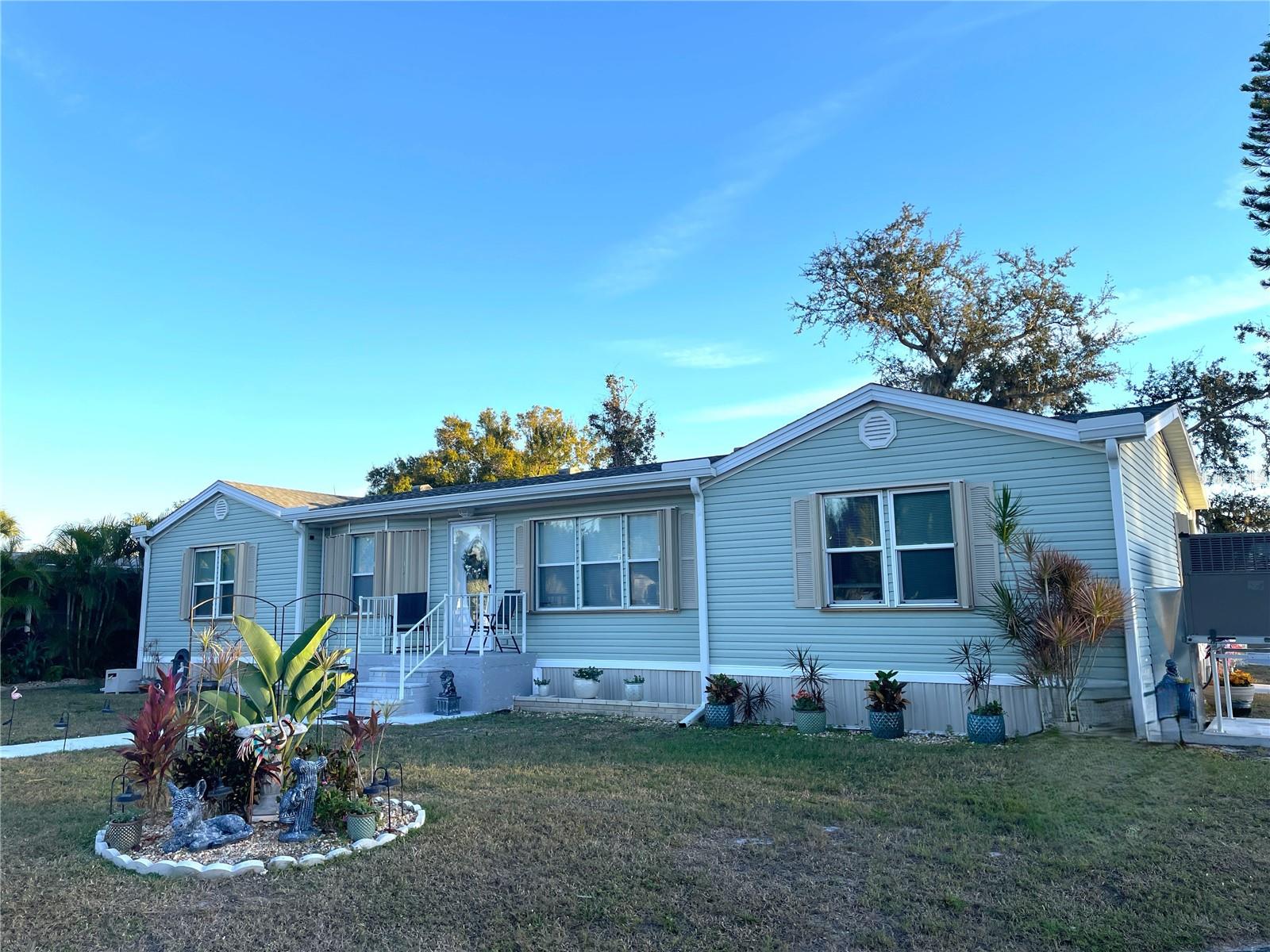 Corner double lot! SPACIOUS 1680sf, 3/2/ 4 car carport, split floorplan, doublewide, 1999 built manufactured home with many upgrades and that sits high and dry (no water damage) in lovely Mary Lu Mobile Home Park (shares are included in the purchase price), a 55+ community situated on the Peace River. The outdoor area has space for 4+ vehicles on the driveway and carport, outdoor sitting area in the shade of the carport along with an enclosed spacious Lanai. There is also a large storage shed with access from the lanai. The Living room and sitting area are at the front of the home. The Dining room is open to the Living room and Kitchen. This home is light and bright with natural light. The Kitchen has solid surface counters, white wash wood cabinets, large island with a prep sink, some newer stainless steal appliances, adorned with beautiful updates and a walk-in pantry. The Primary bedroom is roomy and has a walk-in closet.  The Primary bathroom has a double bowl vanity, jetted spa, and walk-in shower. Across the home... the 2nd and 3rd bedrooms have walk-in closets. The guest bathroom has a tub/shower. The inside Laundry room leads out to the Lanai. There is plenty of storage in the home! Updates include new light/exhaust fans in the bathrooms, all of the ceiling fans/lights, many faucets, Hot water heater, dishwasher & refrigerator, LVP flooring and carpet 2024, accordion shutters, sealed all duct work, new and enforced vapor barrier, UV light and a/c system in 2025. A/C system has a 10 year warranty. Roof, soffits, gutters, downspouts, and skirting 2023 (after Hurricane Ian). There is a community club house, shuffle board, private boat ramp for shallow draft boats, and open common area along the Peace River. The community is working on replacing the pier this year to have boating access. This is WELL MAINTAINED home is ready for you! Security cameras and curtains do not convey.