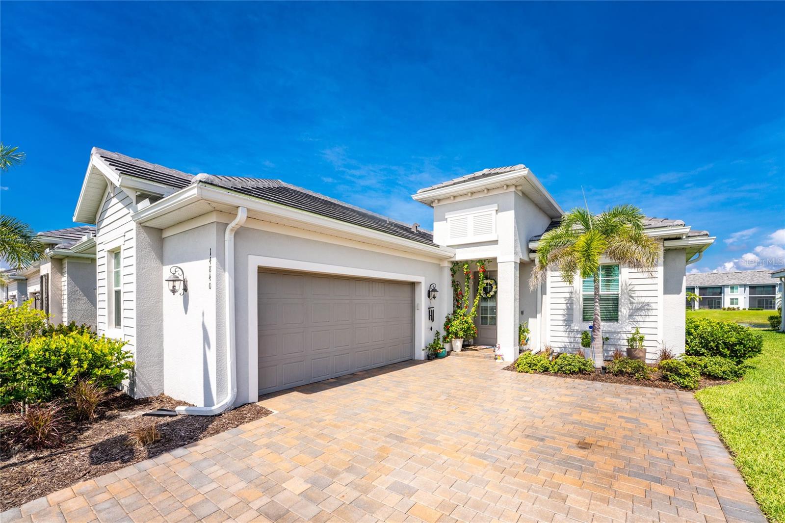 **Luxury Lakefront Home with Water Views in Front and Back in Heritage Landing Golf & Country Club**
Built in 2023, this beautifully appointed 2-bedroom, 2.5-bath smart home offers 1,874 square feet of living space under air and showcases stunning lake views from both the front and back of the home. Located within the prestigious gated community of Heritage Landing Golf & Country Club, this exceptional residence combines modern luxury with resort-style living.
Step inside to discover an open and inviting floor plan enhanced by crown molding throughout, remote-controlled window treatments, upgraded kitchen countertops, a designer backsplash, custom range hood, upgraded Café refrigerator, and custom closet organization systems. Impact-resistant windows and doors provide peace of mind, while smart home technology adds convenience and efficiency to everyday living. The garage features a professionally coated floor, and the paver driveway has been tinted and sealed for added curb appeal and durability.
The spacious screened lanai is the perfect place to relax, entertain, and take in panoramic lake views and unforgettable sunsets. This property also benefits from a Letter of Map Revision (LOMR), eliminating the requirement for flood insurance.
Heritage Landing offers an exceptional lifestyle with five community pools, a state-of-the-art fitness center, full-service spa, resort-style pool with a tiki bar, tennis and pickleball courts, miles of sidewalks and bike lanes, and a Grille Room offering both casual and private dining. Golf enthusiasts will appreciate the community's private 18-hole championship golf course; however, golf membership is not included with this property.
Whether you're searching for a year-round residence or a seasonal retreat, this meticulously maintained home delivers luxury, comfort, and the very best of Southwest Florida living.
Schedule your private showing today and experience the Heritage Landing lifestyle for yourself.
