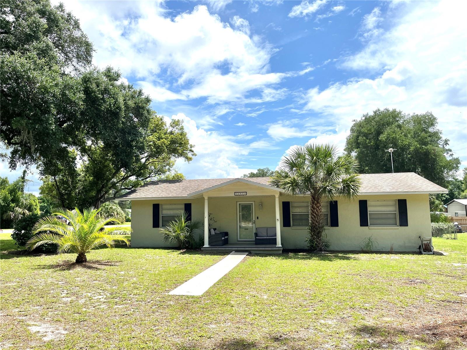 NO HOA + HUGE FENCED YARD + POOL, WELL-MAINTAINED AND MOVE-IN READY.   If you’ve been waiting for a property where you can finally have space, freedom, peace of mind and no restrictions—this one is worth a look.  3 BR 2 BA block home on .41 acre corner lot.  Bring your boat, RV, or toys.  Above-ground pool + charming screened lanai. Major updates already done: Roof, A/C, Septic.  This is the kind of property buyers ask for all the time… but rarely find at this price point. Picture what YOU will do with this much yard space? Pool party setup? RV parking? Garden? Workshop? Find the best of Florida small town living convenient to shopping, entertainment, health care and schools.