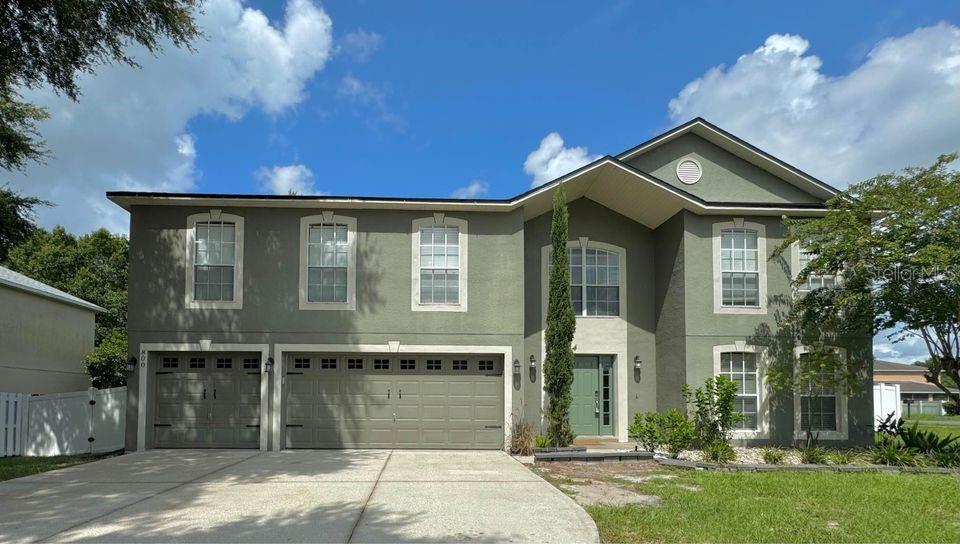This stunning and spacious home boasts 6 bedrooms and 4.5 bathrooms, covering over 4000 square feet of living space. Featuring generously sized rooms, two separate family rooms, and three bedrooms with private baths. The layout includes a formal living room and dining area, along with a kitchen equipped with a large walk-in pantry, island, granite countertops, stylish backsplash, and modern amenities.

The home includes two full master bedrooms—one on each floor, offering privacy and convenience. Outside, you'll find a large screened porch with newer pavers, an open paver patio with a pergola, and a spacious fenced backyard with vinyl fencing, a gate, and situated on a corner lot. Additional highlights include inside laundry facilities and a three-car garage.

Conveniently located near shopping, restaurants, and schools, this home is just 20 minutes from The Villages, 38 minutes from Mount Dora, 40 minutes from Clermont, an hour from Ocala, and the West Coast beaches. With its array of features and prime location, this beautiful home is a must-see. Contact us today to schedule a viewing!