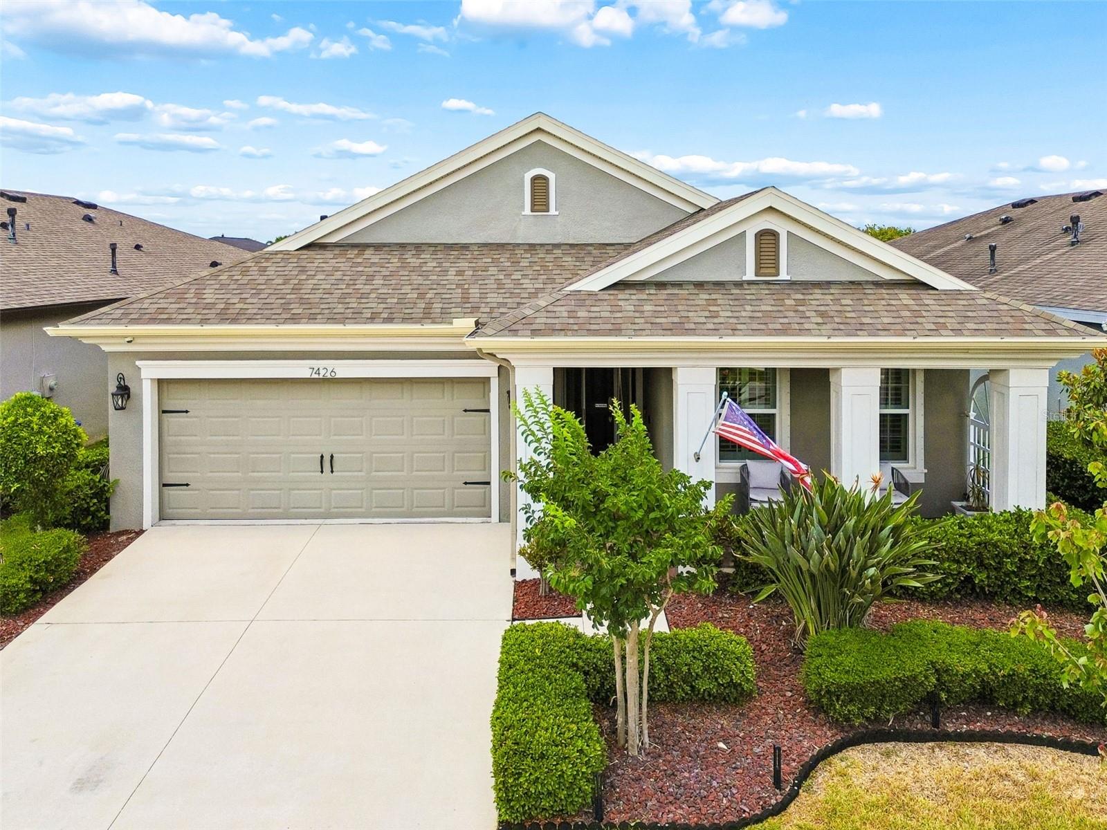 Welcome to this thoughtfully designed residence in the sought-after Waterset community, where everyday living is centered around comfort, connection and convenience. From morning coffee on the front porch to evenings spent poolside under the screened lanai, this home offers a lifestyle designed for relaxation and entertaining. Inside, the three-way split floor plan provides privacy and flexibility, complemented by elevated finishes throughout. The chef's kitchen features built-in GE appliances, a gas range, stone countertops, and generous prep space, creating a natural gathering place for family and guests. Wood-look plank tile flows throughout the home, enhanced by crown molding, high ceilings, upgraded lighting, and plantation shutters that add warmth and character. The private office with French doors offers an ideal work-from-home setup or flex space, while the living area showcases a custom accent wall with a fireplace, mantle and wall-mounted television for cozy evenings at home. Spacious primary and secondary living areas provide functionality for everyday life and hosting alike. Go outside to enjoy Florida living year-round with a large, screened lanai and a poolside dining area, ideal for weekend gatherings or quiet afternoons in the sun. In Waterset, residents enjoy resort-style amenities including multiple pools, a splash pad, sport courts, game room, dog parks, fitness center, clubhouse, and more than 12 miles of greenway and fitness trails. Enjoy the best of both worlds with convenient access to Tampa, MacDill Air Force Base, Sarasota and the Gulf Coast beaches, while enjoying the sense of community and lifestyle that make Waterset one of the area's desirable places to call home.