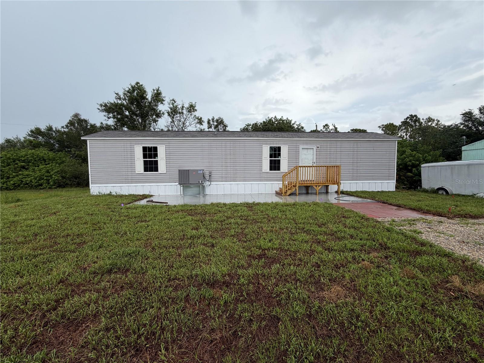 Adorable, BRAND NEW 2 Bed, 2 Bath Manufactured Home. Wood-plank style flooring throughout.  Split bedroom plan.  Kitchen features white shaker cabinets, Whirlpool Refrigerator, Range and Dishwasher.  Recessed Lighting.  Washer/Dryer Hookup.  Front and Rear Decks.  12'x35' Concrete Patio.  Concrete, Stem Wall Foundation and Asphalt Roof.  New Well, Septic and Automatic Irrigation System.
This little beauty has it all!   Make your appt today!