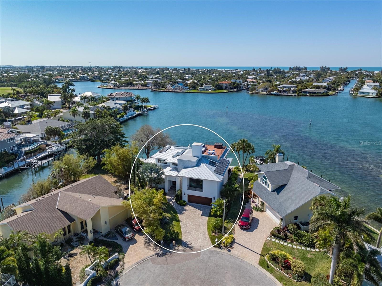 Welcome to the 726 Key Royale Drive show stopper! BUILT BRAND NEW IN 2018.Nestled at the northern-most point of Key Royale in the exclusive North Point neighborhood on Anna Maria Island. This unique Bimini Bayfront home with breathtaking expansive vistas AND DEEP WATER FOR BOATING is a coastal masterwork built to fortress-like standards, offering unparalleled durability, safety and peace of mind in today’s environment. Engineered with all poured concrete, including the re-bar reinforced foundation, the property is also equipped with all Miami-Dade rated hurricane impact glass, and a whole house Generac generator (500 gallon LP GAS).  This 5,541 total sq.ft. of luxury coastal contemporary boasts 5 bedrooms ENSUITE 5.5 bathrooms, a den, office and workout flex space AND is offered FURNISHED less personal artwork and a few exclusions. Roof top terrace and oversized 2 car garage plus golf cart parking.  There are TWO primary suites, one on the main level and the other is on the 2nd level.  The home is equipped with state of the art solar electric system on the roof which keeps the electric bills to a minimum. Significant features include: Elevator access to all floors, electric blinds throughout the home, on demand tankless water heater, custom window treatments, custom oversized closets in each bedroom, zoned 2 AC systems, premium grade  GE Monogram kitchen appliances (Gas cooking), ice machine, wine refrigerator, and bonus 2nd refrigerator.  Sliding walls of glass opens to spacious terraces  and guests will delight in the views across the bayou with breathtaking sunsets and skies. There is an abundance of sea and bird life at all times of the day including dawn and dusk. For water sports and boat lovers there is a new 5” x 38” dock in 2020, New 138 ft SEAWALL in 2020 and a cleverly designed kayak launch to effortlessly lower kayaks and paddle boards into the water.
Enjoy the many wonderful amenities that the North Point/Key Royale neighborhood has to offer including the Key Royale Golf club, 9 hole golf course, tennis/pickle ball courts, and a clubhouse.  There is plenty room for a pool (sketch attached is for a 6" x 22" size) and design and price are in attachments, A true one-of-a-kind property that seamlessly blends elegant design with practical livability all while living the coastal dream of Anna Maria paradise! Assumable Flood policy of just $1,180 per year!
