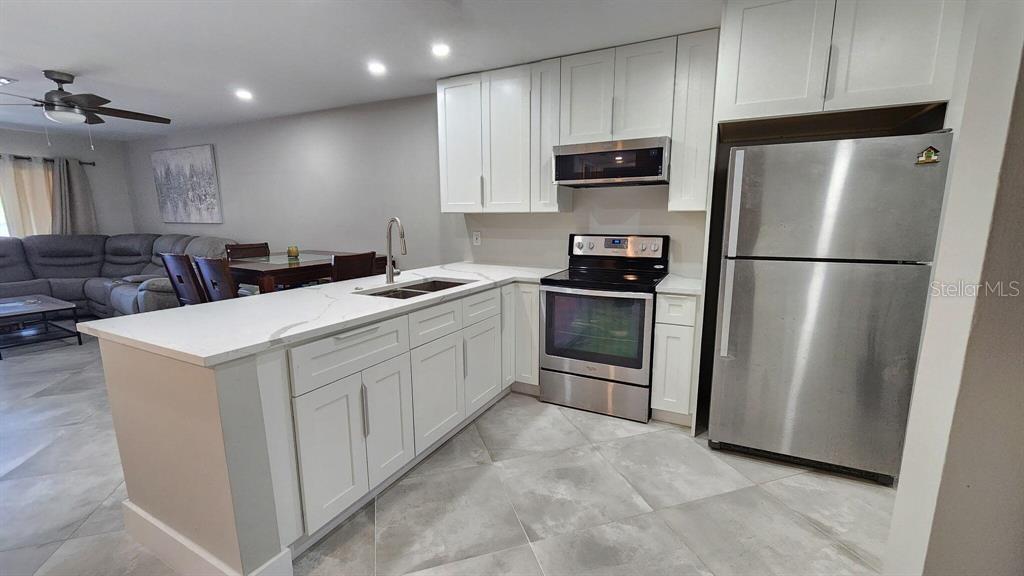 Welcome to this beautiful well maintained 2/2 condo in the heart of Coral Springs. This inviting unit features a newly updated kitchen with modern finishes. The spacious layout offers lots of natural light creating a warm atmosphere throughout. Ideally located just a 1 minute drive to Downtown Coral Springs, you can also enjoy a short walk to Celebration Grounds, where community events like food trucks and live music bring the neighborhood to life. Prefer a staycation? Take advantage of the heated community pool or host gatherings at the club house, complete with a BBQ grill, gazebo, and plenty of seating for friends and family. The HOA includes water and trash adding extra value.