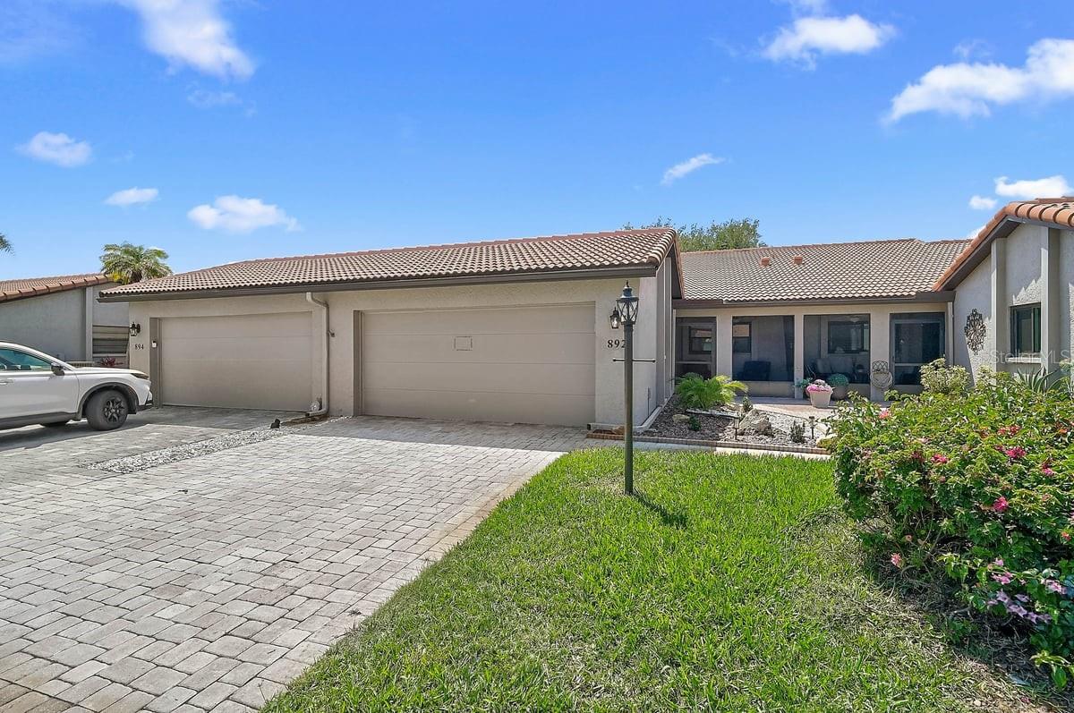 Welcome to maintenance-free living in the highly desirable Jacaranda Country Club Villas! This beautifully updated, move-in-ready 2-bedroom, 2-bath villa offers the perfect blend of comfort, convenience, and Florida lifestyle. Inside, you’ll find a bright and open floor plan featuring updated countertops, stainless steel appliances, breakfast bar seating, renovated bathrooms, spacious bedrooms, indoor laundry, and an attached two-car garage.

Step outside and enjoy your private front patio or relax on the screened lanai, perfect for morning coffee or evening sunsets. The community pool is just steps away, making it easy to enjoy resort-style living every day.

One of the standout features of this home is its proximity to Jacaranda Golf & Country Club, located just a golf cart ride away. The club offers a public championship golf course, so you can enjoy golf without a mandatory membership. For those looking to elevate their experience, optional memberships provide additional benefits, including reduced cart fees, exclusive member privileges, and access to club events. Residents can also enjoy dining at the country club, creating a true country club lifestyle without the obligation of membership.

Conveniently located just minutes from historic downtown Venice, Gulf beaches, shopping, restaurants, medical facilities, and some of the area’s finest golf courses, this villa is ideal as a full-time residence, seasonal retreat, or investment opportunity.

Professionally maintained and priced to sell, this is an exceptional opportunity to own one of the best values in Venice while enjoying the carefree lifestyle that makes Jacaranda Country Club Villas one of the area’s most sought-after communities. Schedule your private showing today and discover why so many love calling Jacaranda home.