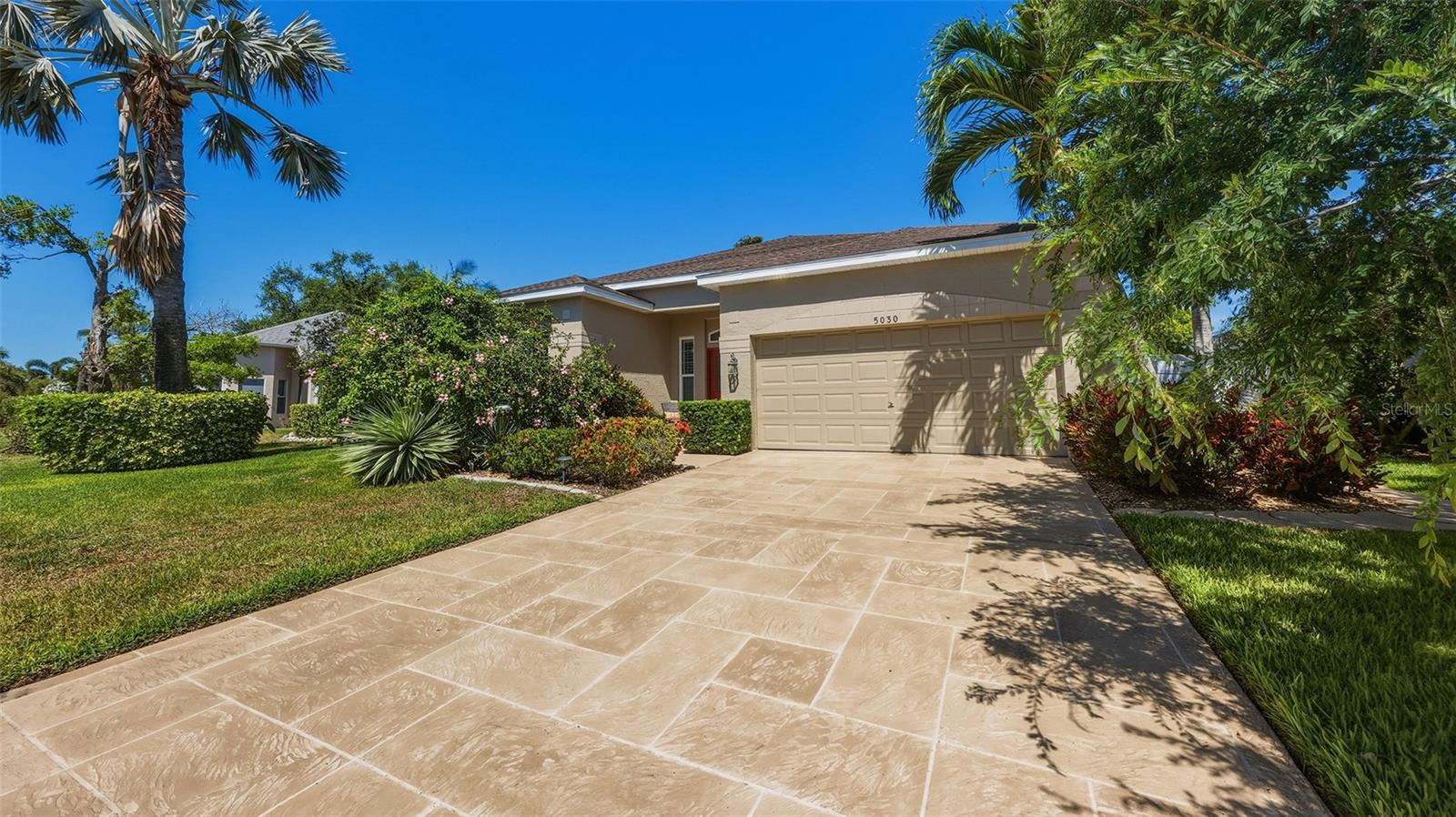 This beautifully updated home offers peace of mind with an impressive list of recent upgrades and modern improvements, making it truly move-in ready. Major system updates include a brand-new air conditioning system (2025), water heater (2020), and a roof installed in 2016. Impact windows and impact sliding patio door (2026) provide enhanced safety, energy efficiency, and storm protection. The home’s curb appeal shines with beautiful professional landscaping, refreshed exterior paint (2022) and a resurfaced driveway (2024), while the updated front door (2022) creates a warm and inviting entrance. Inside, you’ll find fresh interior paint (2025) and elegant plantation shutters (2022) that elevate both style and functionality throughout. Offering 4 bedrooms and 2 bathrooms, this home features a layout ideal for both everyday living and entertaining. Located in Glenn Lakes, the property is perfectly positioned just minutes from IMG Academy and the stunning beaches of Anna Maria Island. Enjoy convenient access to an   abundance of dining, shopping, golf, and entertainment options right at your fingertips. The outdoor living space is a true highlight, featuring a beautifully resurfaced and retiled pool (2025), a new pool heater (2025), and a pool pump (2020). The pool cage has been freshly painted and rescreened (2024), creating the perfect setting for relaxing or entertaining year-round. The primary suite has been thoughtfully upgraded with beautiful wood cabinets, quartz countertops and tons of extra storage. The primary closet is a walk-in dream with a custom closet organization system. You’ll love the large kitchen with 42” wood cabinets, granite countertops and stainless appliances making cooking a joy. With extensive updates already completed, this home seamlessly blends modern comfort, efficiency, and style—allowing you to move in and start enjoying the Florida lifestyle right away.