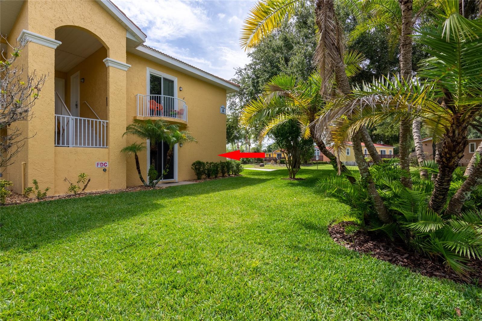 Lake view - First Floor End unit 2 bedroom condo!!!   A deal - come see.  Mirrored wall in bedroom and dining room! Updates to this unit.  Freshly painted, new floors, Stainless-Steel Appliances, Dishwasher. Granite in kitchen and baths. Relax outside with your coffee at your outside patio clothing optional retreat area.   Step out through the sliding doors into the screened lanai, where indoor-outdoor living blends seamlessly with serene nature views. Whether you’re looking for a full-time home or a tranquil escape, this condo delivers modern upgrades, privacy, and the signature resort lifestyle that makes Caliente truly unique. Membership with ownership required.