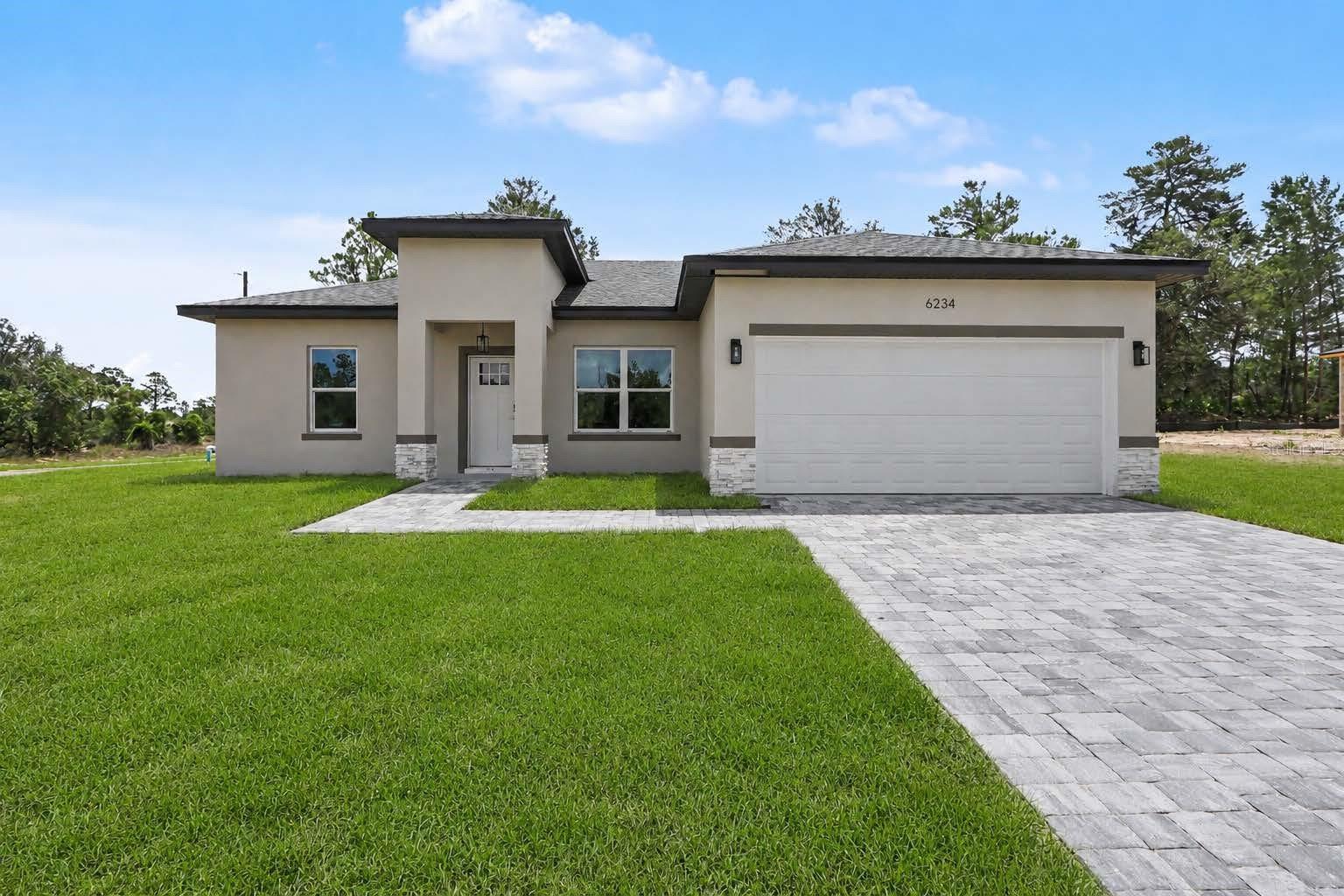 NEW CONSTRUCTION HOME FOR SALE IN CITRUS SPRINGS! 
Located on a spacious 0.36-acre corner lot, this brand-new 3-bedroom, 2-bathroom home by Prati Homes offers 1,860 total square feet of modern living space in one of Citrus County's fastest-growing communities. Featuring an open-concept floor plan, stylish finishes, abundant natural light, and a kitchen equipped with stainless steel appliances, this move-in-ready home is designed for both comfort and entertaining. The oversized corner lot provides additional privacy and outdoor space rarely found in new construction homes. Conveniently located near Target, Walmart, shopping, restaurants, schools, and medical facilities, with easy access to US-41 and the Suncoast Parkway for commuting to Tampa and surrounding areas. No HOA. If you're looking for a new construction home in Citrus Springs with modern finishes, an oversized lot, and a prime location, this property is a must-see. Easy showing through ShowingTime.