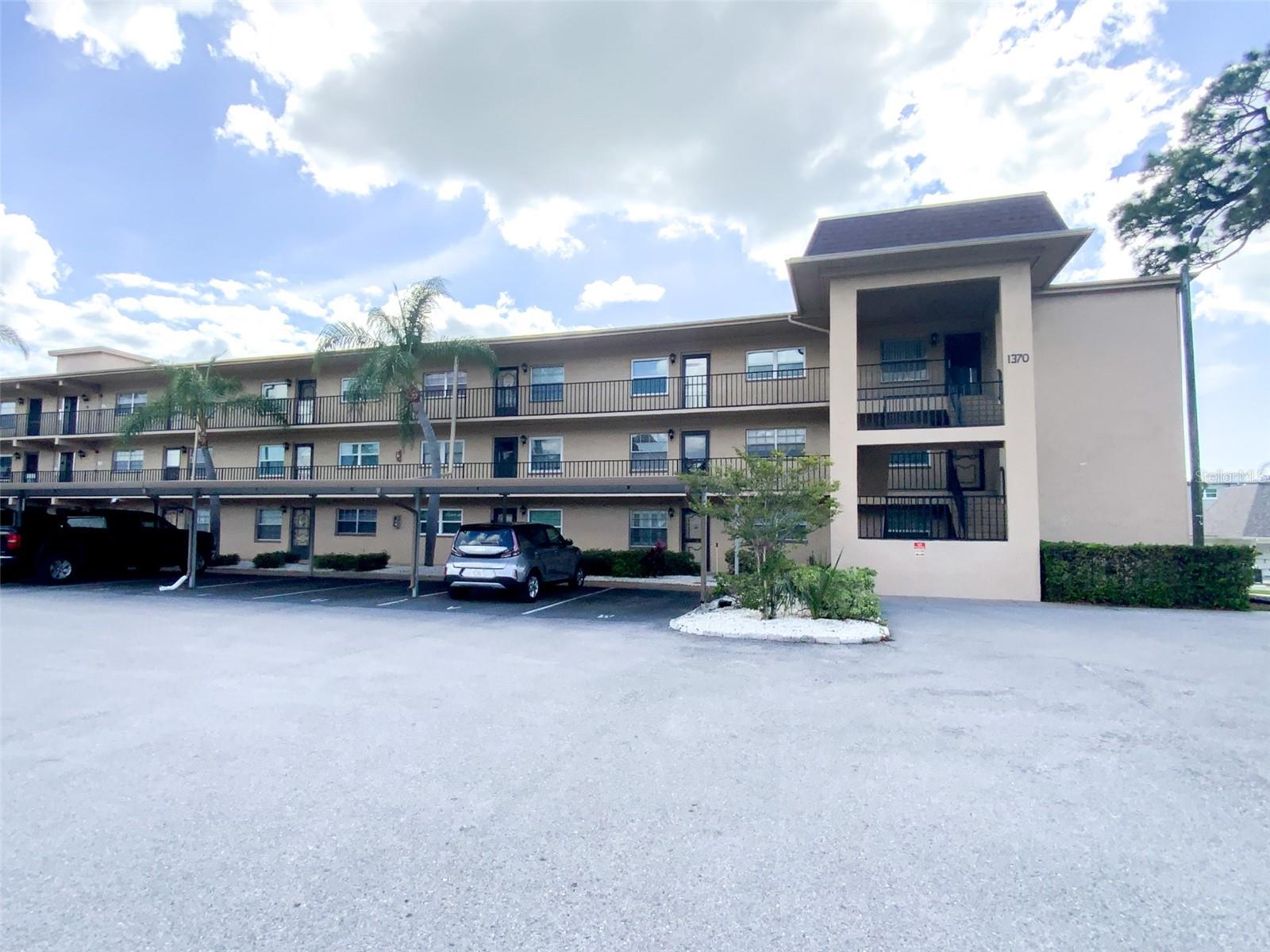 PRICE REDUCED...Prime Opportunity in Heather Ridge – Dunedin’s Desirable 55+ Community! Discover effortless Florida living in this bright and welcoming second-floor condo in the sought-after Heather Ridge 55+ community. With its clean lines and functional elegance, this home offers a sophisticated yet comfortable retreat. Step inside to a spacious foyer that welcomes you into an open, light-filled living space. Abundant windows flood the interior with natural sunshine and frame beautiful views of the community grounds from the expansive, full-width screened lanai. Whether you’re enjoying morning coffee or evening relaxation, the screened balcony provides the perfect spot for soaking in the Florida sunshine and gentle breezes. Just steps from your door, the sparkling community pool invites you to unwind. Heather Ridge residents enjoy fantastic amenities including multiple outdoor pools with lounge areas, shuffleboard courts, covered parking with guest spaces, on-site laundry facilities, and peaceful green spaces with scenic ponds. Located in the heart of Dunedin, this prime spot puts you minutes from vibrant downtown Dunedin — with its acclaimed restaurants, unique shops, festivals, and charming atmosphere — as well as world-class beaches like Honeymoon Island and Caladesi. Enjoy the perfect blend of low-maintenance condo living and an active, social 55+ lifestyle. This is Florida living at its best. A must-see — schedule your private showing today!