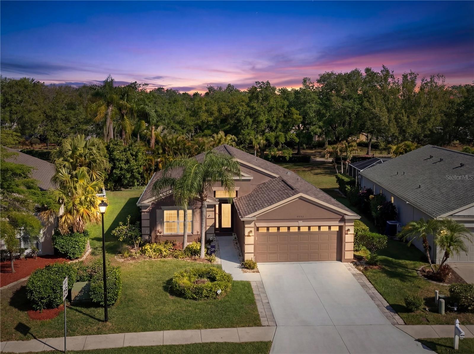 Well-maintained four-bedroom, two-bath home located in the desirable Sabal Harbor community of Bradenton, offering 1,678 square feet of comfortable living space and a functional, open layout with vaulted ceilings and a two-car garage.

This residence has been thoughtfully updated, allowing the next owner to move in with confidence. Major improvements include a roof replacement in 2019, HVAC system in 2019, interior and exterior paint in 2018, and updated flooring in 2019. The kitchen features granite countertops and stainless steel appliances, including a refrigerator replaced in 2020, range and microwave in 2021, and dishwasher in 2021. Laundry appliances include a washer replaced in 2025 and dryer in 2024.

The primary bathroom was fully remodeled in 2023 and offers dual sinks and modern finishes, creating a clean and updated retreat. Additional updates include a hot water heater replaced in 2025 and a transfer switch installed for generator use.

Outdoor living adds a unique dimension to this home. A screened lanai with a hot tub installed in 2021 provides a private space to relax, while the backyard features a putting green and golf practice area, offering a rare and enjoyable feature for both casual and dedicated players. The lot backs to a pond, offering added privacy with natural foliage.

Sabal Harbor residents enjoy access to a community pool, playground, volleyball area, basketball court, tennis courts with pickleball, and open green spaces with low HOA fee. Conveniently located near shopping, dining, and major roadways, this property offers both comfort and accessibility.

This is a home where key updates are already complete and everyday living feels easy, inside and out.