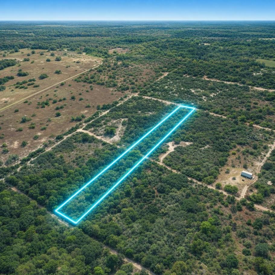 Build or Place your home on this 2.5-acre parcel located on NE 56th Street in Bronson, Levy County. Zoned A/RR (Agricultural Rural Residential), this property allows for mobile homes or site-built homes, offering options for a primary residence or investment opportunity. No HOA, No CDD, and located in a Non-flood zone, providing fewer restrictions and added value.

Setback requirements include approximately 50 feet at the front and rear, and 10 feet at the sides. The property features rural road access and is surrounded by natural Florida landscape, offering privacy and a quiet rural setting.

Conveniently located approximately 30–35 minutes to Gainesville and 35–40 minutes to Ocala, providing access to shopping, dining, hospitals, and major roadways while maintaining a rural environment.

This property may be eligible for USDA financing, which may allow qualified buyers to purchase with 0% down when combined with a new construction or new manufactured home, subject to lender approval and program guidelines. For land-only purchases, qualified buyers may explore financing options with approximately 20% down payment.