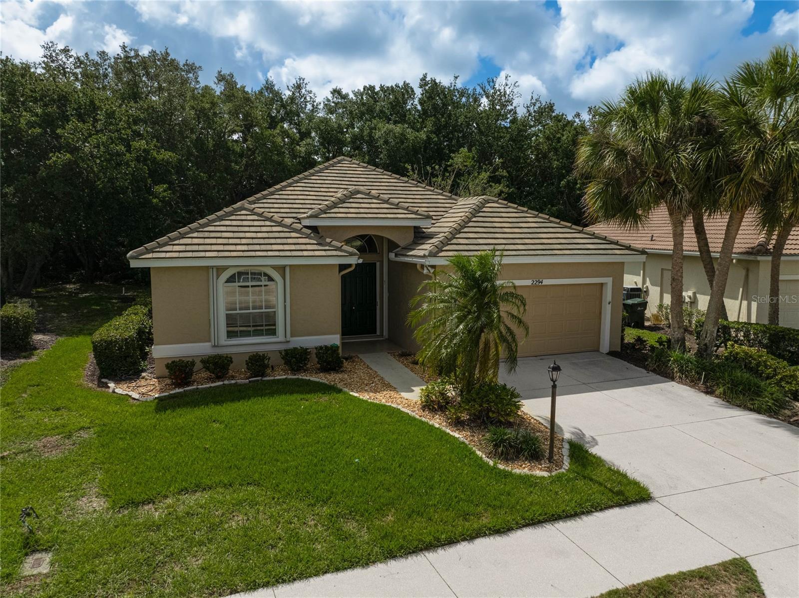 Picture yourself enjoying the relaxed Florida lifestyle at 2294 Harrier Way in the Falcon Trace section of Calusa Lakes in Nokomis. This 1,897 sq ft 2-bedroom, 2-bath home with a versatile den/office was built in 1999 and updated with a new roof in 2019, a new AC system in 2018, and hurricane shutters for added protection and peace of mind. The standout feature is the private spa on the lanai — the perfect spot to unwind after a round of golf, a day at the beach, or an afternoon exploring nearby Venice or Sarasota. The real advantage here is maintenance-free grounds. The HOA handles the exterior landscaping and lawn care, giving you true grounds-free living so you can spend your time enjoying Florida instead of mowing or trimming. It’s the kind of low-hassle setup that makes daily life easier, whether you’re staying year-round or just for the season. Residents enjoy exclusive access to the community pool, tennis courts, and the new pickleball courts, perfect for staying active and socializing with neighbors. Golf enthusiasts will appreciate that membership in the Calusa Lakes Golf Club is entirely optional — there is no requirement to join. If you prefer a private club experience, the adjacent Mission Valley Country Club sits right next door, offering an excellent alternative without ever leaving the area. Imagine starting your day with coffee on the lanai, heading out to the beach, tennis or pickleball courts, or the optional course, and returning in the evening to relax in your own warm spa surrounded by mature landscaping. The flexible den/office provides space for remote work, hobbies, or guests, while the indoor-outdoor flow and hurricane shutters make everyday living feel both comfortable and secure. You’re just minutes from the white sands of Nokomis Beach, the shops and restaurants of Venice Island, and everything Sarasota has to offer, with convenient access to major routes. Whether you’re searching for a primary Florida retirement home, a seasonal snowbird property, or a comfortable Sarasota-area home with recent updates and practical features, this residence delivers easy, enjoyable coastal living with the flexibility to choose your own golf experience and personalize the home to your taste.