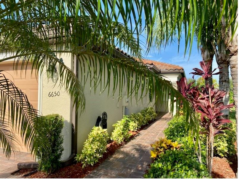 SPECTACULAR backyard views check out this MOVE IN READY VILLA HOME  located in the Renowned RIVER STRAND GOLF & COUNTRY CLUB! This quaint Villa is pristine and tastefully fully furnished making your move extremely easy! Relax in privacy on the  back lanai and adjoining patio with natural backdrop on far side of pond - limited view of other homes provides a uniquely remote feel. Astounding Sunrise & Sunset Views! Expand the lanai to  enhance outdoor living if you choose!  As you step inside you will feel right at home! There is a large kitchen and open floor plan. The kitchen is bright and roomy with Stainless Steel appliances and premium wood cabinets. Custom lighting in dining area and  kitchen bar area. Quiet Study where you can work from home or relax and do some reading. If you enjoy tennis, swimming, pickle ball & working out  with country club living this is the perfect home for you! Maintenance free which includes all landscaping and lawn maintenance in your HOA fees. This Villa is the home of one owner and has been meticulously maintained. Upgrades are luxury vinyl flooring in the Master and guest bedroom and premium wood cabinets. HUGE Garden Tub with separate shower in Master Bathroom. Large Den/ office that could be used as a third Bedroom. The Garage has extra space with Overhead storage. This home is conveniently located to shopping, restaurants, parks, medical care and entertainment.
As a social membership home, you'll have full access to all resort amenities - including the main clubhouse, on-site restaurant, Tiki bar & grill, resistance pool, tennis courts and more. Golf lovers can take advantage of the 27-hole championship course designed by Arthur Hills with pay-as-you-play access. HOA includes lawn & sprinkler maintenance, Spectrum cable & high-speed internet for added convenience and savings. Buyer to pay one time capital contribution totaling $5000 for social deeded home and one time membership transfer fee of $610 to River Strand. One time Capital Contribution to Heritage Harbour $1,000.