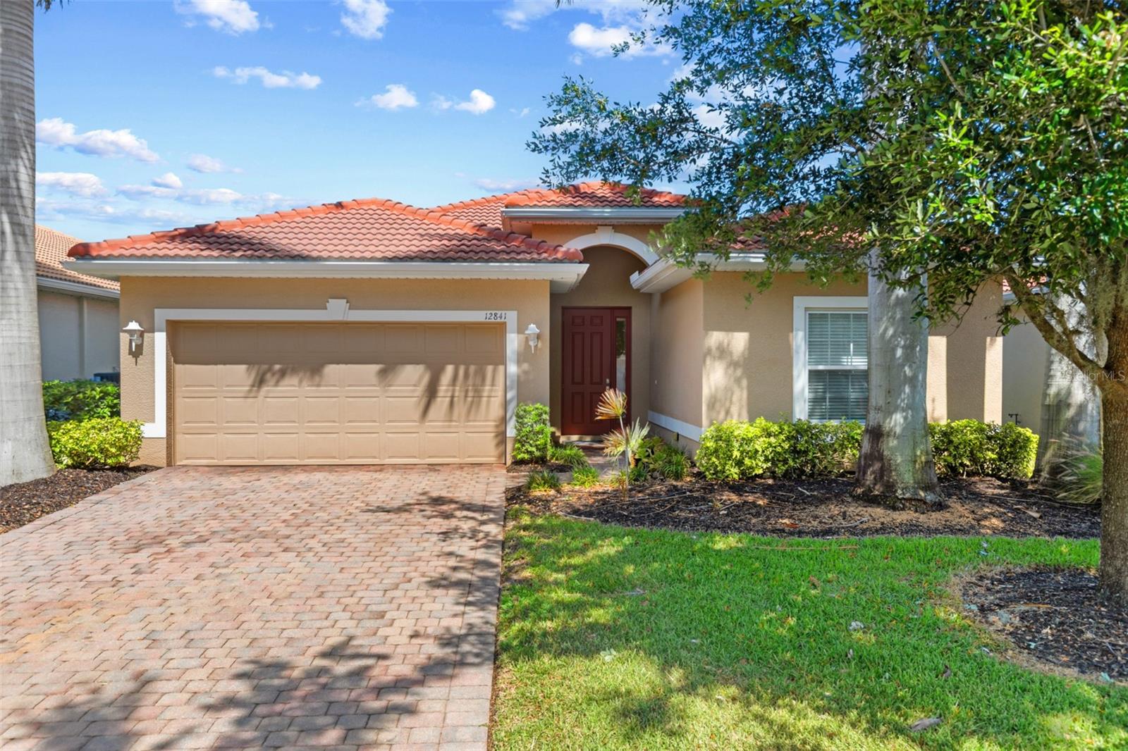 Welcome to 12841 Seaside Key Ct, where over 1,800 square feet of well-maintained living space awaits. This 3-bedroom, 2-bathroom home features an inviting open floor plan detailed with tray ceilings and diagonal tile flooring. At the heart of the home is a beautiful kitchen equipped with stainless steel appliances, granite countertops, and 42-inch high quality cabinetry finished with crown molding. The thoughtful design includes a split-bedroom configuration for ultimate privacy, and high-quality cabinetry in both baths too. Outside, the property is surrounded by professional landscaping and classic brick paver accents on the driveway, walkways, and lanai, all safeguarded by a durable tile roof. For the water enthusiast, this property offers the rare advantage of direct water access—use that closing credit toward building your own private boat dock right on-site! Nestled in the gated, maintenance-free community of Moody River Estates, you will enjoy a resort lifestyle just minutes from the Fort Myers Downtown River District. Residents have exclusive access to a premier clubhouse, fitness center, resort-style pool, and a private boat launch. Tour Today!