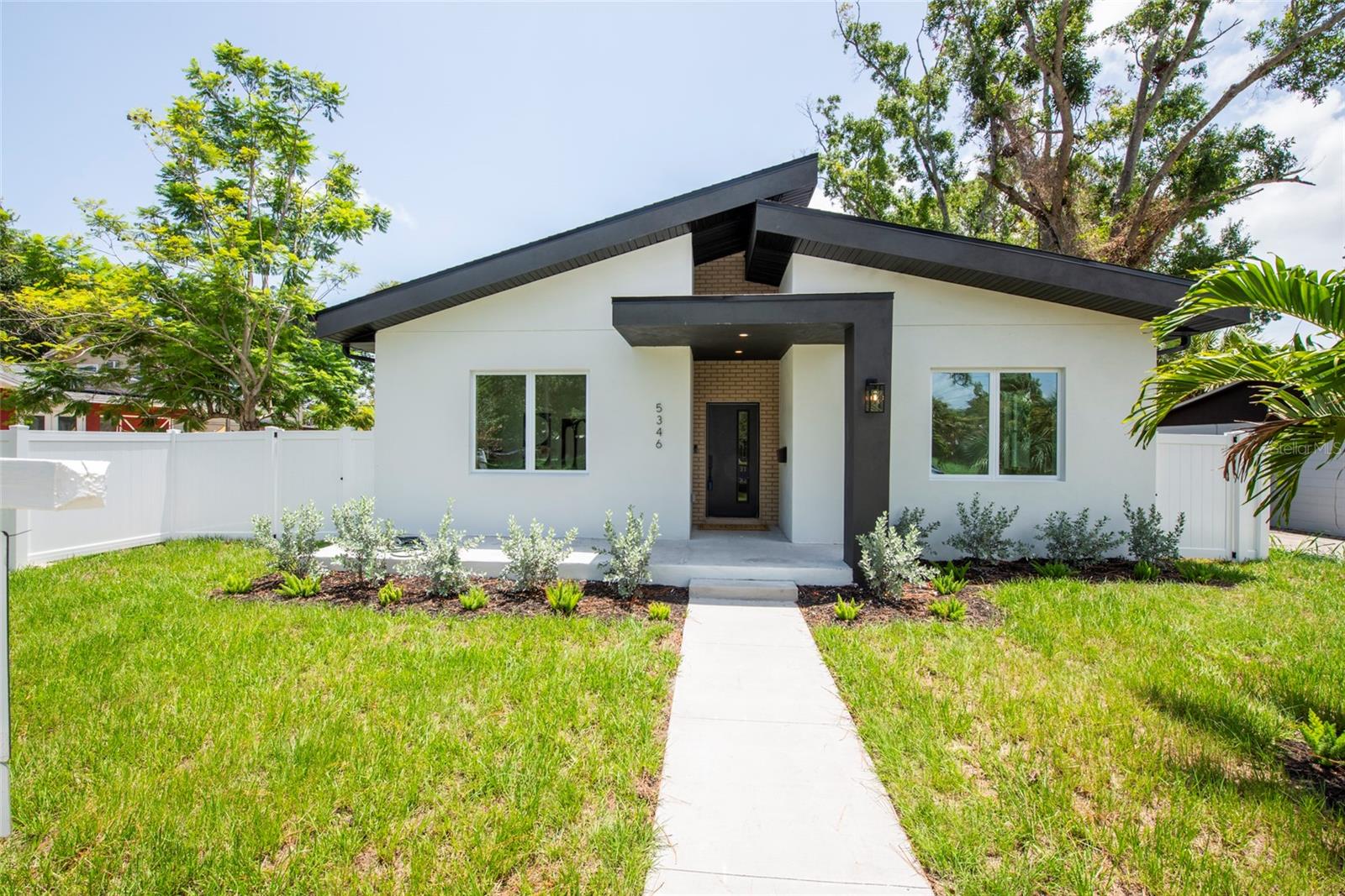 Welcome to this beautifully crafted new construction home, featuring soaring high ceilings, a spacious open-concept floor plan, and quality finishes throughout. Situated on a beautiful lot in a non-flood zone, this home offers both peace of mind and modern convenience. The thoughtfully designed kitchen is the heart of the home, showcasing elegant stone countertops, a large center island perfect for gathering, and an oversized walk-in pantry for abundant storage. The spacious primary suite offers two generous walk-in closets, creating a true private retreat.  Additional highlights include a rear-entry two-car garage and a prime location just off Central Avenue, ideally positioned between the Gulf beaches and vibrant downtown St. Petersburg Harbor. Enjoy easy access to shopping, dining, entertainment, parks, and everything St. Petersburg has to offer.
This is modern Florida living at its finest; don't miss your opportunity to own this exceptional new home!