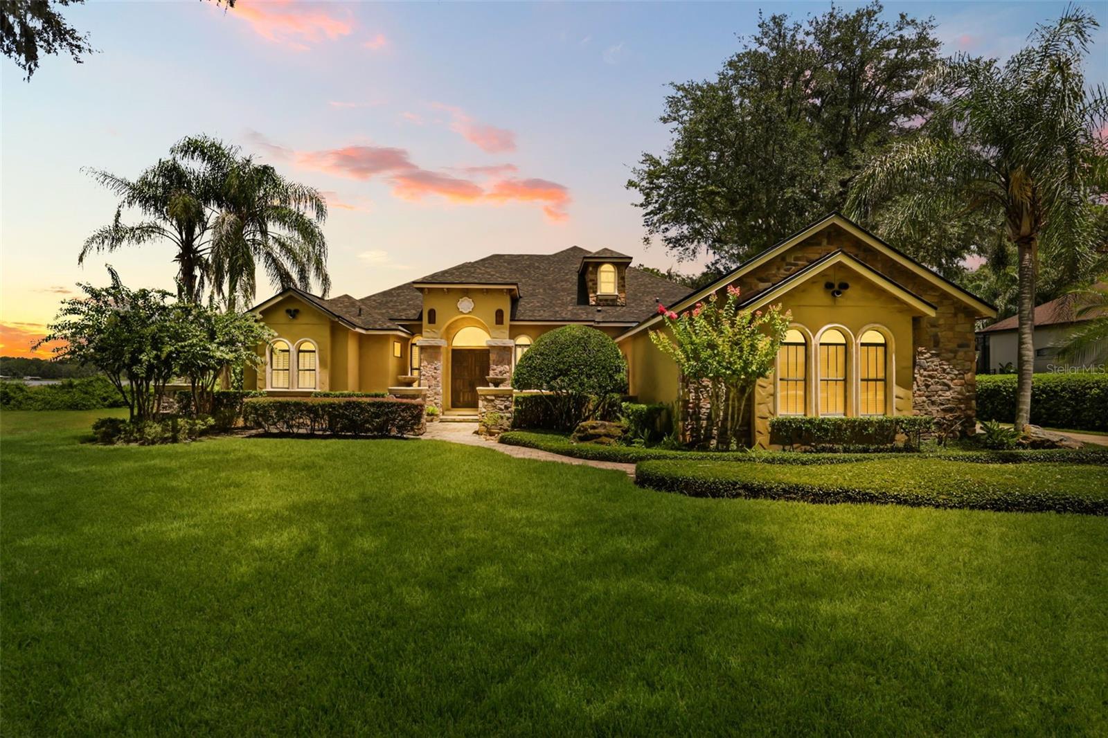 Exceptional Markham Woods Estate with Resort-Style Pool, Spa & Premium Upgrades.
Gated Community.  
One of the finest lots in the highly sought-after Cardinal Pointe subdivision, this stunning custom estate home offers nearly 3,400 square feet of luxury living on a private, sprawling acre lot. Built in 2004, this exceptional residence is perfectly positioned with beautiful wooded views and backs to the natural preserve of Lake Markham, offering unmatched privacy and the ideal Florida lifestyle.
This impressive home features four spacious bedrooms on the main level, plus an oversized upstairs bonus room with a full bath. The private main-level primary suite is a true retreat, offering a comfortable sitting area, French doors, dual closets, and a beautifully updated bath with a soaking tub and marble shower.
The home has been thoughtfully upgraded with exceptional attention to detail, including wood-textured tile flooring throughout all bedrooms, upgraded carpet with premium underlayment in the bonus room and staircase, fresh interior paint, plantation shutters, crown molding, and a pocket door adding privacy to the primary bath. The family room has been enhanced with custom surround sound wiring, while previous partitions were removed to create a more open and inviting floor plan.
The gourmet kitchen is designed for entertaining and features stainless steel appliances, 42-inch cabinetry, granite countertops, a large island, breakfast bar, and built-in breakfast nook. Additional upgrades include granite countertops in the laundry room and hall bath.
The spacious family room showcases disappearing sliders that open to an expansive covered paver lanai overlooking the private screened-in pool and spa. The resort-style pool features a Pebble Tec finish, creating a beautiful outdoor retreat perfect for relaxing or entertaining guests.
Additional highlights include an oversized three-car garage, decorative iron staircase railing, coffered ceilings, elegant architectural details, and a premier location in one of Central Florida’s most desirable luxury communities.
This is truly Florida living at its finest—combining privacy, elegance, and resort-style amenities in the heart of Markham Woods. 
Call today to request your private showing.