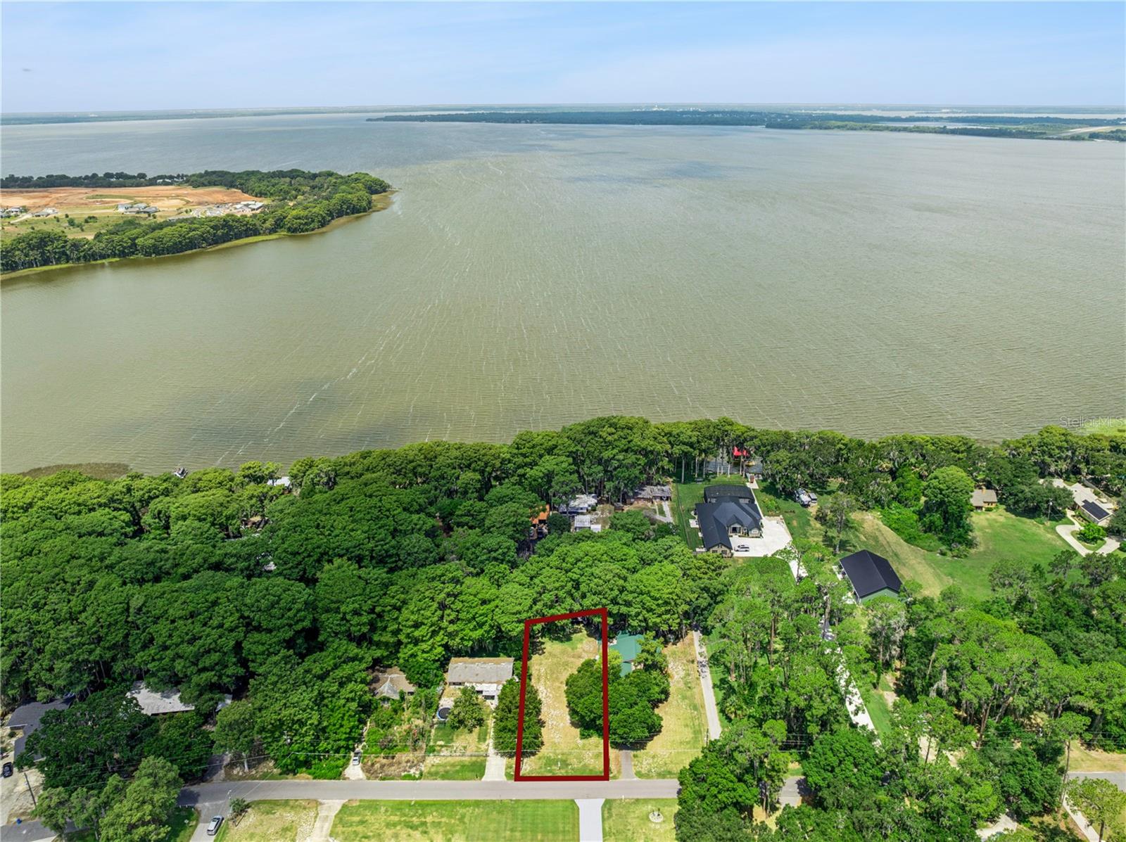 Ready, Set, Build   Looking for the perfect piece of land to build your dream home.   This property situated on a Canal Front leading to Lake Harris and the Harris chain of Lakes is the one for you   This lot is Cleared and Level perfect for building your home.   Contact me today this property will not last.
