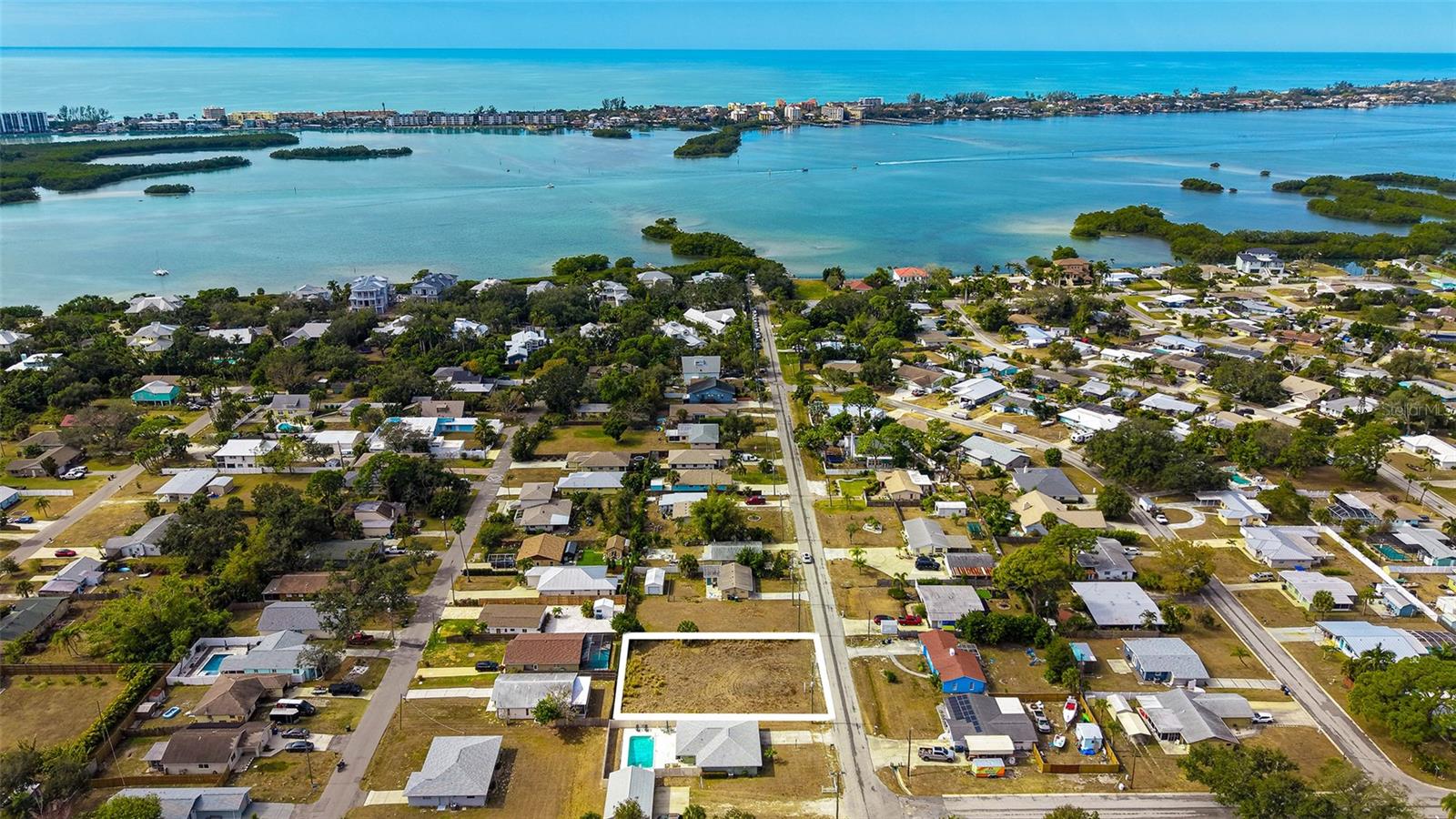 Rare Opportunity to Purchase a Beautiful Building Lot in the Tropical Shores Neighborhood Area just West of the Trail at this Price! The 2 Lots Next Door are also for Available for Sale (MLS A4641765 & A4641766) so you could potentially Own a Double or Triple Lot and Build a Fantastic House close to the Water and yet be in a NO Flood Zone! OR Buy All 3 Lots together for $475,000! Each Lot size is 50x126. Water at property, Septic Needed, Non-Deed Restricted. Park your Boat or RV at Home! NO HOA. Community Boat Ramp Close By. Just Minutes to Shopping, Costco, Restaurants, Bus Transportation and Beaches! (Updated Pics Coming - Lot is located Directly to the Right of the Outlined Double Lot)