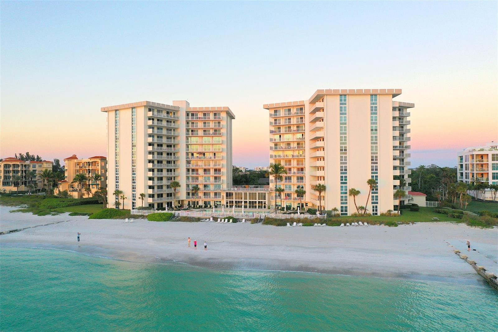 Rare Beachfront Opportunity - Two Adjacent Residences at The Islander Club, South Longboat Key Seize a truly rare and unique opportunity to own two adjacent Gulf-front residences in the North Tower of The Islander Club on South Longboat Key. Featuring highly sought-after southwest and northwest exposures, these first-floor walk-out condos live like a maintenance-free beachfront home, with no stairs or elevators and direct access from two private terraces to the Olympic-size beachfront pool and the private white sandy shores of the Gulf of Mexico’s crystal clear aqua waters. 
Combined, the residences offer 2,500+ square feet of Gulf-front living space, including four beachfront bedrooms and four full bathrooms, two balconies with over 500 square feet of total outdoor frontage, and expansive walls of glass showcasing panoramic Gulf views, brilliant sunshine, gorgeous sunsets, and refreshing cross-breezes. The layout functions as an expansive and seamless beachfront residence with flexible configuration options—combine both units into one refined Gulf-front luxury home, or live in one and rent the other, or tailor and customize the space for personal use or investment potential.

Located directly on the beach in South Longboat Key, this one-of-a-kind legacy property is just three miles from St. Armands Circle and minutes from downtown Sarasota’s dining, shopping, and cultural attractions. Two covered parking spaces are included, along with additional guest parking available.

The Islander Club features 400 feet of private beachfront, a new fitness and community center, beachfront pool, two Har-Tru tennis courts (soon to be remodeled for pickleball use as well), library, conference room, on-site management, gated access, and a highly advantageous and rare owner-to-owner rental program. Convenient to Publix, CVS, acclaimed restaurants, boutique shopping, and Sarasota’s renowned arts scene.

Enjoy breathtaking Gulf sunsets and an unmatched Longboat Key beachfront lifestyle at one of Longboat Key’s most sought-after beachfront addresses.