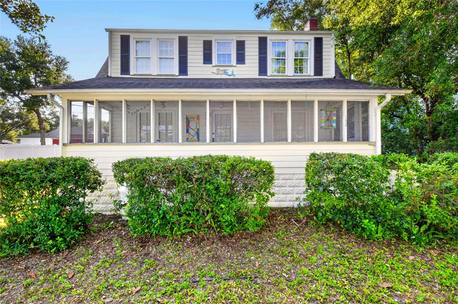 VERY CHARMING, VINTAGE MOUNT DORA HOME!  Make this filled with unique features home your own! The first floor has a large living room with a propane gas fireplace for those cozy winter nights. The dining room features a classic chandelier, the perfect place for dinner parties! The kitchen takes you back in time with plenty of cupboard storage and a nostalgic breakfast nook area that also looks out over the back yard for a lovely morning view. There is also a downstairs laundry room with lots of built in storage and easy clean tile floor. Two screened porches, front and back of the home give you plenty of options for relaxation or spaces for hanging out with guests, and also features a BBQ area. Windows throughout the home are newer and are uniquely decorated with custom made window decor. Wooden and Vinyl flooring in the living room, dining room and upstairs bedrooms is also a newer installation. A separate workshop, ideal for hobbies, was added in the back yard in 2003 and comes with full bathroom. Downtown Mount Dora with its unique shoppes, local restaurants, and many festivals each year, is only a few blocks to the west. It is a historic, waterfront district in Central Florida known for its 19th-century charm, rolling hills, and vibrant, walkable streets. Located just 30 miles northwest of Orlando, it overlooks the shores of Lake Dora and serves as a major hub for festivals, antique shopping, and local dining The newly completed northern beltway around Orlando is now open and is just minutes from this home for easy commuting to all areas of Central Florida.  Mount Dora is nestled on the Harris Chain of Lakes so from Lake Dora you can travel by boat to Lake Harris, Lake Eustis, Lake Beauclaire, Lake Carlton, Little Lake Harris, Lake Griffin and Lake Yale.  This very charming home is waiting for you to explore today!
