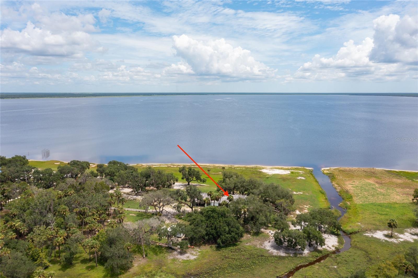 Drive, fly, or come by boat!! Come fall in love with this LIGHT and AIRY completely UPDATED contemporary LAKEFRONT home on Lake Harney. This block construction home includes 5 spacious bedrooms, which includes 2 masters, 3 bathrooms, all with walk in showers, quartz countertops, and white porcelain flooring throughout. 12 sets of floor to ceiling sliding glass doors, with panoramic breathtaking views throughout. Home includes a very spacious living and dining room space, a eat in kitchen with a large center island with stainless steel appliances, and storage galore! The perfect home for large family gatherings! Home also includes a large outdoor patio, the perfect place to sit and watch the sunrise. The property consists of 2.33 acres of secluded peaceful outdoor space, with large majestic oak trees, 200ft of LAKE FRONTAGE, located at the dead end of the road with no close by neighbors! A nature lovers dream come true. Love to boat, fish, swim, garden, you can do it all! Plenty of outdoor space for all your toys, seaplanes, and there is even a second LAKEFRONT lot available for purchase with the sale of the home. The perfect place for a large workshop or for a airplane hangar for your seaplane!! NO HOA, FAMILY FRIENDLY NEIGHBORHOOD, AWESOME SCHOOLS and just a truly one-of-a-kind HOME. ALL FURNITURE IS NEGOTIABLE....MOVE IN READY! SCHEDULE YOUR PRIVATE SHOWING TODAY....COME CHECK OUT THIS VIEW!