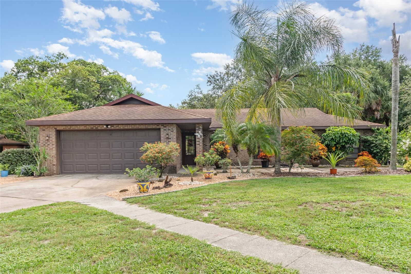 Spectacular Opportunity — Live, Work & Play on 1.6 Acres! Step into the epitome of Florida living with this beautifully maintained brick 3BR/2BA ranch, offering 1,665 sq. ft. of comfort and style on a sprawling, landscaped property. Designed with a split floor plan, this home blends privacy and functionality, creating the perfect setting for family and entertaining. The grounds are equally impressive, featuring an expansive detached garage/workshop, entertainment gazebo, and wide-open spaces to relax or create your vision. High and dry, this property is not in a flood zone. Adding unmatched value is the included thriving nursery business — complete with approx. $8K in fruit tree inventory, equipment, a 2005 Ford F-150 truck, and tools — offering immediate income potential or a foundation for your own venture. With zoning under the Osteen Mixed Use Village Classification, the possibilities for the future are extraordinary: schools, subdivisions, medical or veterinary clinics, and more. This property can be subdivided into more residential lots. This rare offering is more than a home — it’s a lifestyle, an investment, and a private compound where you can truly live, work, and thrive.