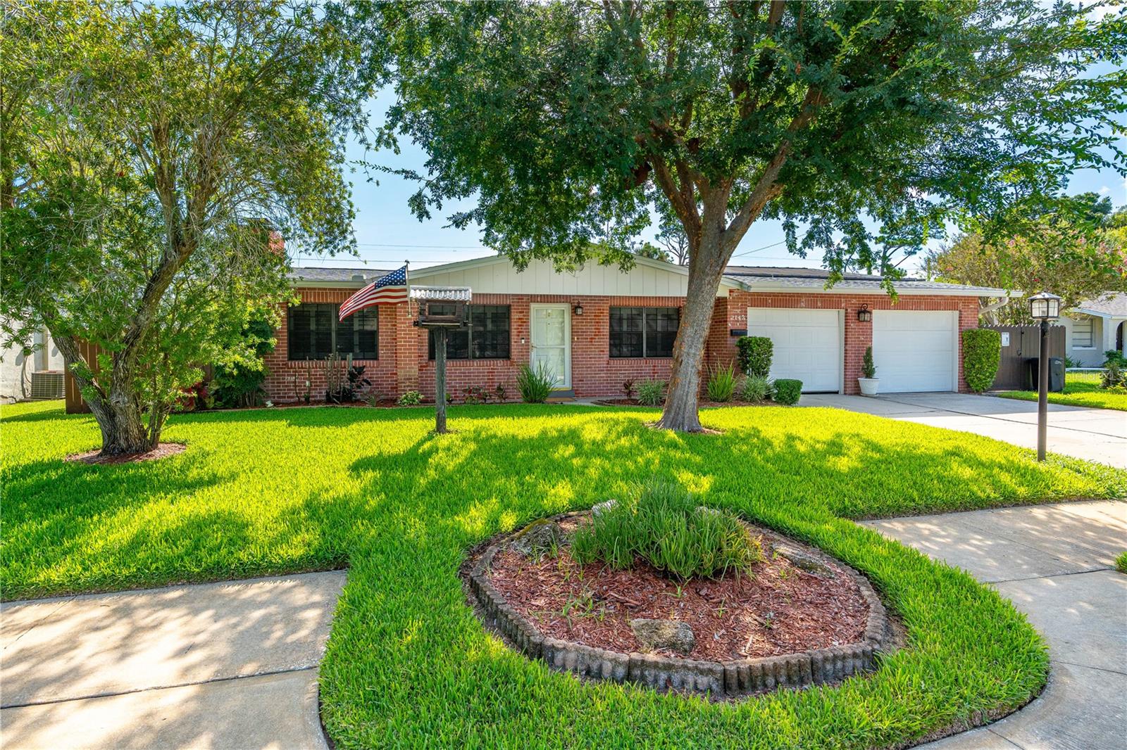 Welcome to Your Private Oasis! This beautiful one-owner home has been lovingly maintained and cared for in every detail. It shows like new and is truly move-in ready. Outside, you’ll find an impressive inground, enclosed, solar-heated pool that’s larger than most pools in the area. It’s custom-designed with attractive lighting features and reaches 9 feet deep at the deep end. The pool pump is only 5 years old and the filter is just 1 year old. The spacious patio and screen enclosure encompass nearly 1,600 square feet — perfect for relaxing or entertaining year-round.  The meticulously landscaped lot is filled with rare and beautiful plants and trees. The lush, golf course-quality grass stays vibrant thanks to a deep well sprinkler system with a brand-new pump. The entire yard is enclosed by a beautiful pressure-treated, stained wood privacy fence. Additional peace-of-mind features include a wood-burning fireplace that is inspected and cleaned annually, a transferable termite bond that has been in place for 30 years, and recent 4-point and wind mitigation inspections that passed with flying colors. Inside, fresh paint and elegant plantation shutters create a bright, welcoming feel as you enter the living room, which features a cozy wood-burning fireplace. The spacious dining room is light and bright. The kitchen offers granite countertops, beautiful cabinetry with plenty of storage, a natural gas range, and nearly new GE Profile refrigerator and dishwasher. A convenient door from the kitchen leads directly into the extra-large two-car garage, which includes custom storage cabinets and a large window for natural light. The garage also has a side exit with dedicated wood storage for the fireplace and a special outlet ready for a generator. This home offers 3 bedrooms and 2 bathrooms, plus a versatile office/den. The primary suite measures approximately 12' x 22' and features a walk-in closet with a private entrance directly to the pool area. The office/den has custom shelving and is ideal for a home office, library, or media room. The guest bath includes a tub/shower combination and is conveniently located for pool guests. Recent updates include a complete electrical rewire with a new breaker box, a newer hot water heater elevated on a pedestal (for safety and potential insurance savings), and R-32 insulation for improved energy efficiency. The home is not in a flood zone and has never flooded. There’s also a large 18' x 20' insulated and electrified shed — perfect for hobbies, storage, or lawn equipment. Conveniently located close to shopping, schools, and the beach, this well-cared-for home is truly a gem. Welcome home!