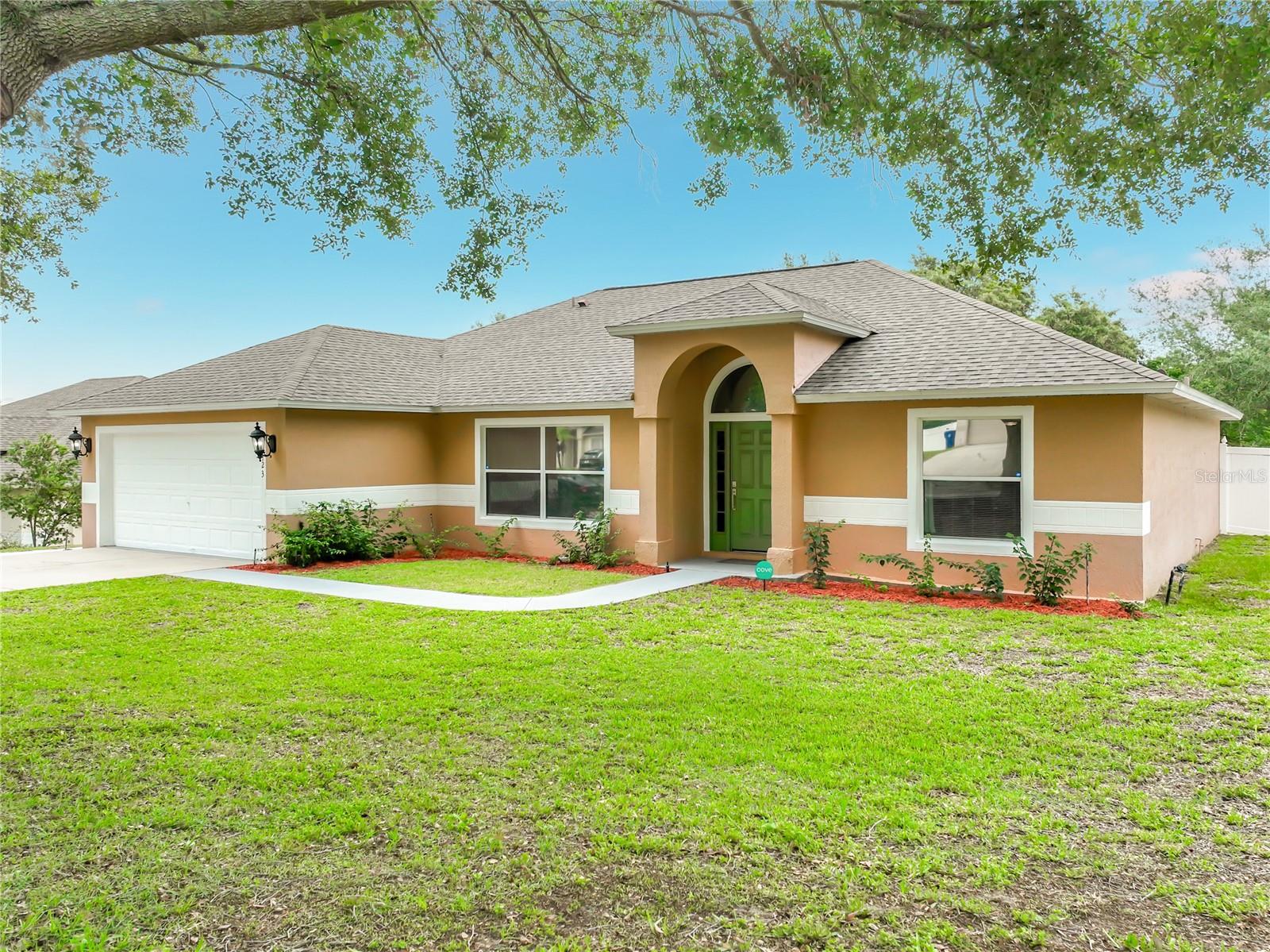 Welcome to this immaculate, move-in ready home nestled on an expansive fenced homesite in one of Minneola's most peaceful and established neighborhoods - Oak Valley. Offering 3 bedrooms, 2 bathrooms, and a versatile single-level floorplan, this beautifully maintained residence combines modern updates with endless possibilities for outdoor living.

Step inside to discover an inviting interior featuring fresh paint, vaulted ceilings, blinds and window treatments throughout, and a spacious combination living and dining area perfect for everyday living and entertaining. A flexible central room provides endless options as a formal dining room, home office, playroom, or hobby space tailored to your lifestyle.

The heart of the home is the generously sized kitchen, complete with stainless steel appliances, granite countertops, a breakfast bar, and ample space for a dining table where family and friends can gather. The private primary suite offers a relaxing retreat with a large walk-in closet and an en-suite bathroom featuring a walk-in shower and soaking garden tub. Two additional guest bedrooms are connected by a convenient Jack-and-Jill bathroom.

Outside, the possibilities are endless on the oversized fenced lot. Imagine designing your dream backyard oasis beneath the magnificent Southern Live Oak that provides natural shade and character to the property. The screened patio offers the perfect place to relax and enjoy the peaceful surroundings year-round.

Additional highlights include a 2-car garage with durable epoxy flooring and overhead storage, a large driveway with abundant parking, smart-home conveniences including app-controlled garage access and HVAC, and major system updates completed in 2022, including the roof, HVAC system, and water heater. Furnishings are negotiable, making this an exceptional opportunity for buyers seeking a truly turnkey home. As an added benefit, the neighborhood allows short-term rentals, creating flexibility for homeowners, seasonal residents, or investors seeking income-producing potential.

Ideally located in the rapidly growing and highly sought-after Minneola and South Lake County area, you'll enjoy convenient access to Downtown Clermont, Florida's Turnpike, parks, walking trails, Lake Minneola, shopping, dining, and the beautiful rolling hills that make this part of Central Florida so unique. This is more than a home - it's an opportunity to create the lifestyle you've been dreaming of.