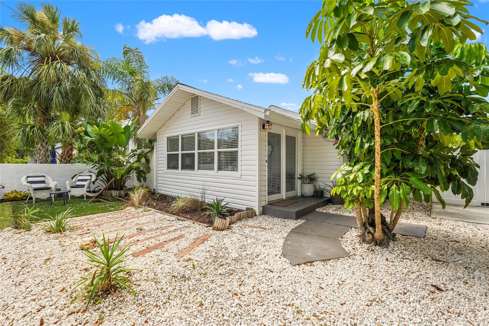 Charming and updated Turnkey Airbnb Bungalow in the Heart of Bradenton – No HOA, No Flood Zone. Welcome to 2705 2nd Ave W, a beautiful and income-producing bungalow in the heart of Bradenton’s historic River District. This active and successful short-term rental currently brings in $40K/year in gross income and offers complete flexibility—no HOA, no deed restrictions, and it’s located outside the flood zone.

Originally built in 1925, this 2 bedroom, 1 bath home offers 1,198 square feet of heated living space plus an added bonus of an oversized light and bright Florida room, all located on a 6,500 sqft lot. Modern upgrades include a 2021 roof, a 2022 electrical overhaul with new main and subpanels (and proper grounding), plus newer appliances from 2024 and 2025. The home is cooled and heated by a central air system.

Inside, you’ll find a light-filled open layout with a spacious Florida room leading out to the covered back lanai with newer pergola from 2022 —ideal for indoor/outdoor living. The fully fenced backyard offers privacy and functionality, with a hot tub, lounge space, covered outdoor dining, mature landscaping, alley access for RV or boat parking, and a powered storage shed that’s perfect for tools, hobbies, or additional gear.

The location is a standout: just 9 miles to the world-famous beaches of Anna Maria Island, less than a mile to downtown Bradenton and the Riverwalk, and only a few miles from both Robinson Preserve and De Soto National Memorial. Sarasota-Bradenton International Airport is just 10 miles away, making travel a breeze. Whether you're looking for a second home, remote owner, or 1031 exchange investor, this property is ready to deliver. Strong income, updated systems, flexible zoning, and an unbeatable location. Schedule your private showing today.