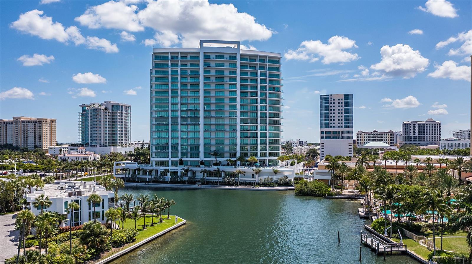 Experience the epitome of sophisticated waterfront living in this 12th-floor, 3-bedroom, 3.5-bath residence in The Ritz-Carlton Residences, Sarasota. Completed in 2021 with a contemporary style and elegant finishes, the Ritz-Carlton’s legendary services, privacy, and world-class amenities - all in a desirable downtown location, redefine luxury living. Entering through a custom double-door foyer from your private elevator, you are welcomed with bright open spaces, soaring ceilings, and stunning views of Sarasota Bay, downtown, and the Gulf of Mexico. The beautiful Emerson floorplan features 11-foot ceilings, 8-inch baseboards, and floor-to-ceiling impact windows and sliders that showcase the expansive water views. The tiled 33x16’ covered terrace features an ElectriChef built-in outdoor electric grill, ideal for entertaining guests while savoring gorgeous sunsets over the bay. Exquisite porcelain tile and J. Geiger electric shades with drapes throughout. The gourmet kitchen boasts high-end appliances such as a Sub-Zero refrigerator/freezer, Wolf gas stove and double ovens. Amidst the generous dining room, you’ll find a wine and beverage fridge, as well as a wet bar, perfect for engaging guests or relaxing with loved ones. The primary suite offers dual custom closets, Toto Wash-let, lighted mirrors, and an opaque glass shower. Tasteful built-ins in the great room and an office complete the balanced space that gracefully flows throughout the design. Resort-style amenities include a pool area that transports you to a waterfront paradise, unrivaled in the city, complete with sun lounging spaces, a poolside grill and alfresco dining area. Additional amenities include a fitness center, 70-ft lap pool/lounging pool and hot tub, a club room for events, game room and access to the adjacent Ritz Carlton  hotel and spa. ADT alarm system, Sonos system, 2 parking spaces and climate-controlled storage. The Ritz Residences offer 24-hour concierge and valet services. Just a few minutes to the Bay, enjoy waterfront trails, outdoor yoga, or launching your kayak. The Van Wezel Performing Arts Center is two blocks away, where you can take in the latest shows and concerts or venture across the street to discover the area's best culinary offerings, theatre, opera, symphony and farmers market. Start living your extraordinary life today!